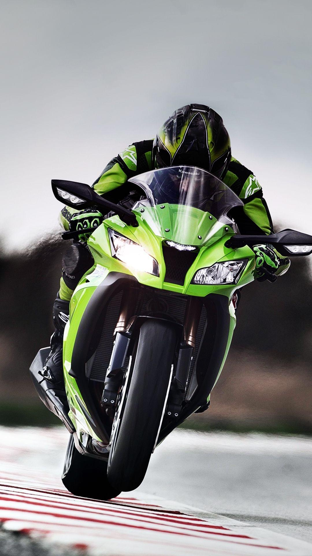Motorcycle Racing: The colors of the outfit and the bike match and complement each other perfectly, Sports gear. 1080x1920 Full HD Wallpaper.