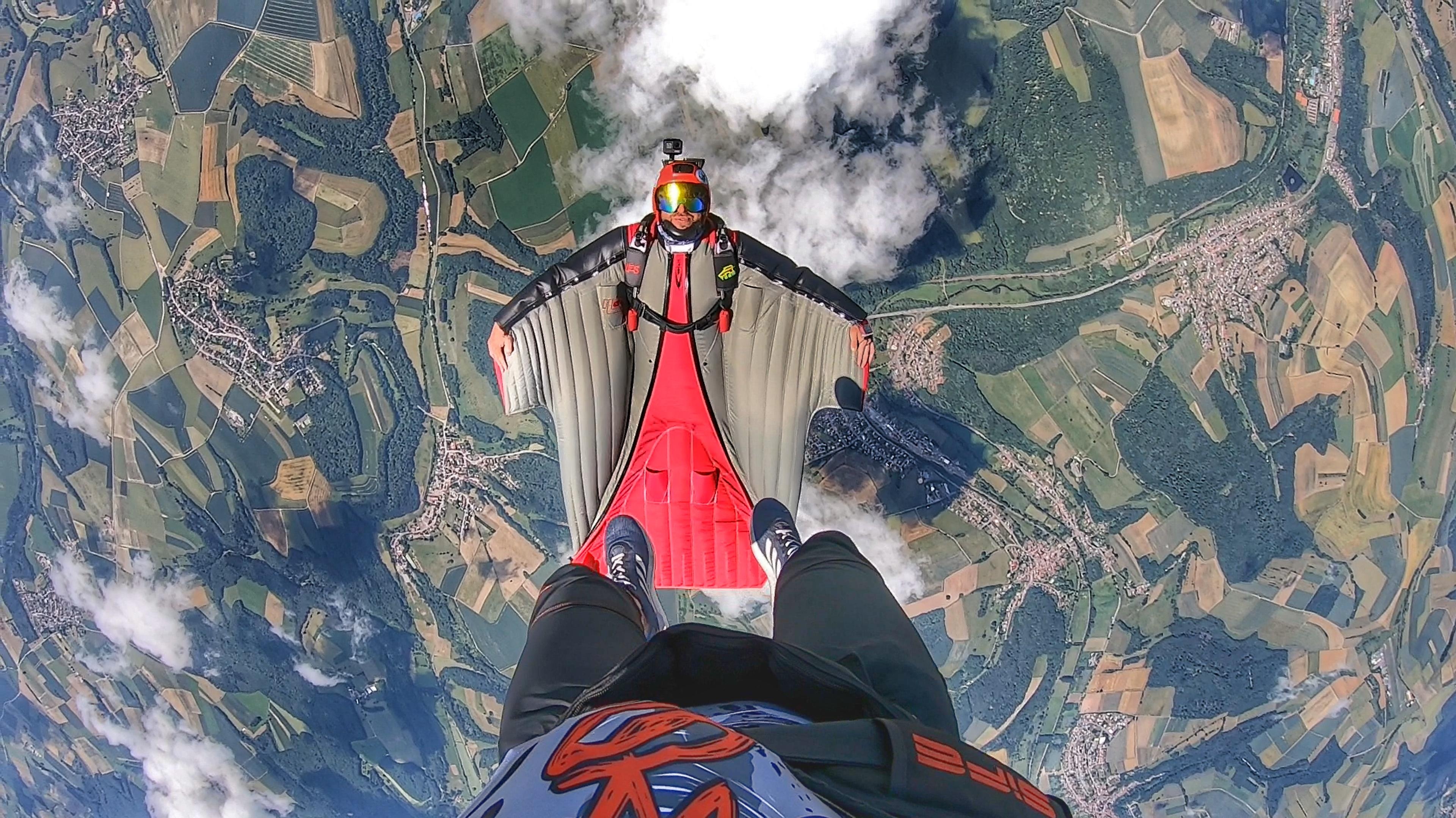 Wingsuit Flying: Pink Skyvan Boogie wingsuiting event, Tandem flying, Extreme sport. 3840x2160 4K Background.