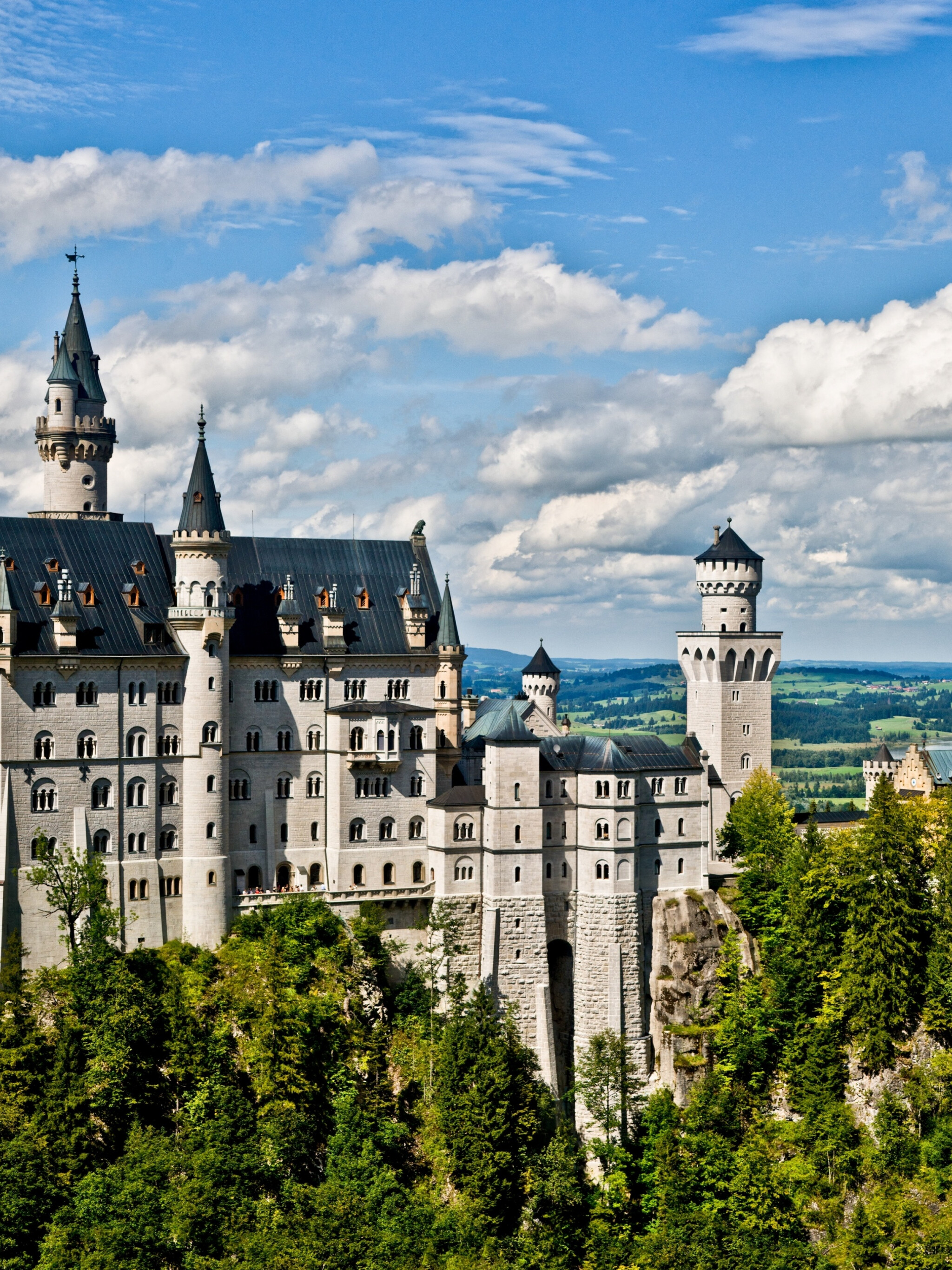 Neuschwanstein Castle: A neo-Gothic, medieval-inspired palace, elaborately decorated with scenes from legend and poetry. 2050x2740 HD Background.