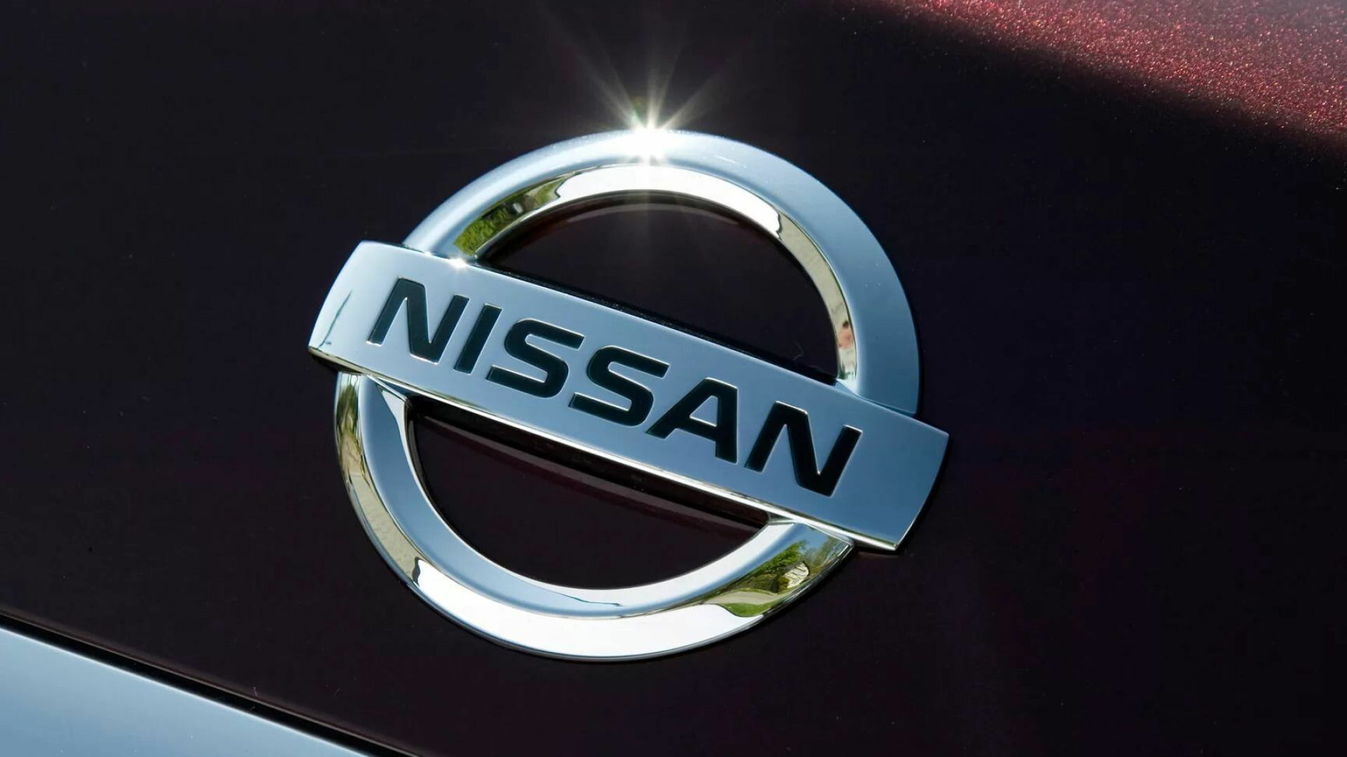 Nissan: Automaker, Known for luxurious sedans and athletic sports cars, Logo. 1920x1080 Full HD Background.