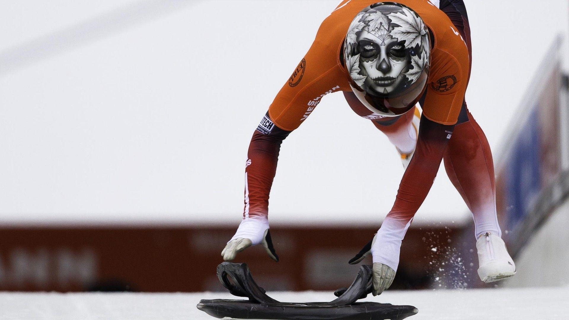 Skeleton (Sport): A winter sliding activity in which a person rides a small sled down a frozen track. 1920x1080 Full HD Background.