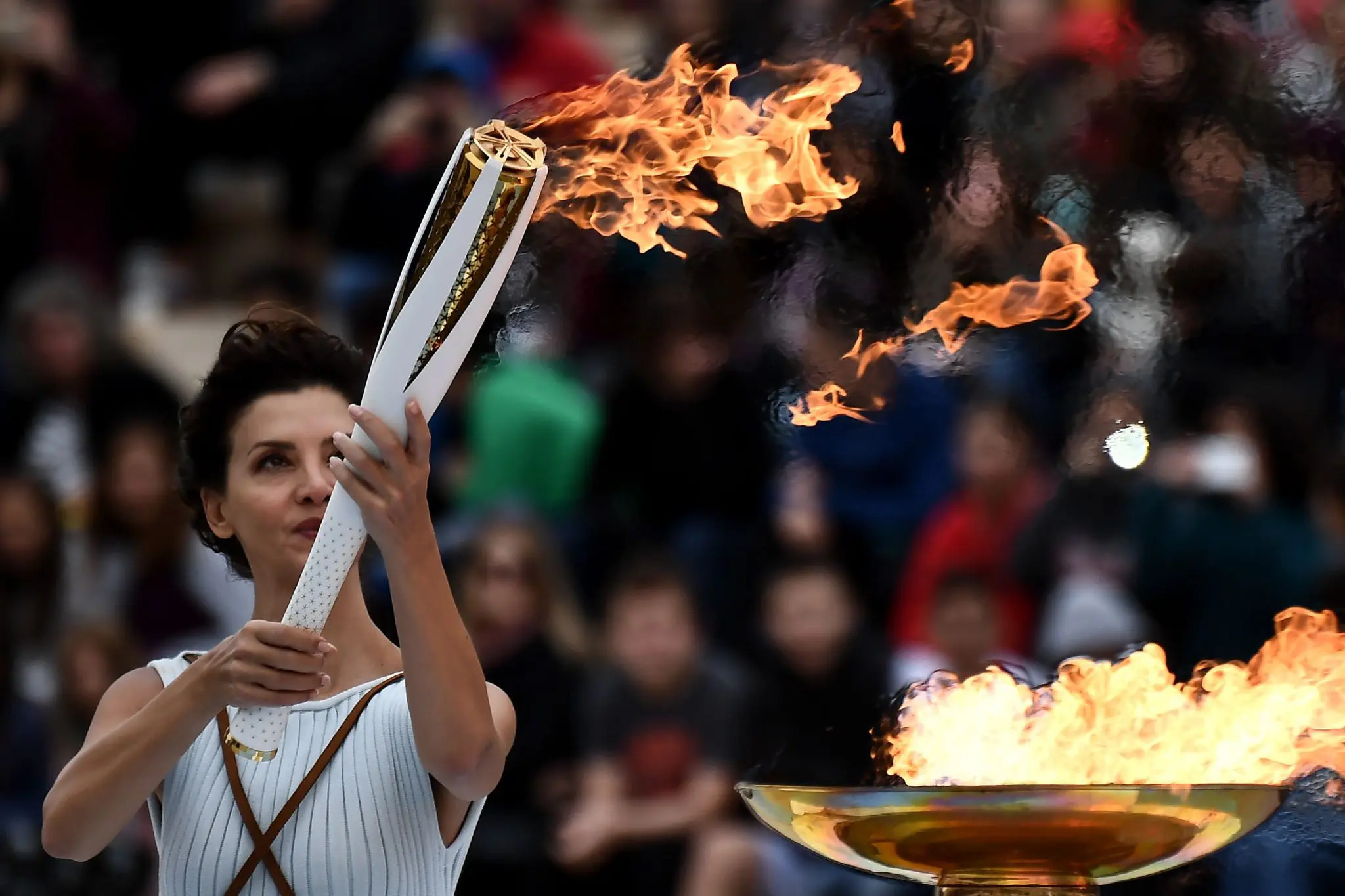 Olympic Flame: Actress Katerina Lechou, Performing a high priestess, The Panathenaic Stadium in Athens, October 31, 2017. 2050x1370 HD Wallpaper.