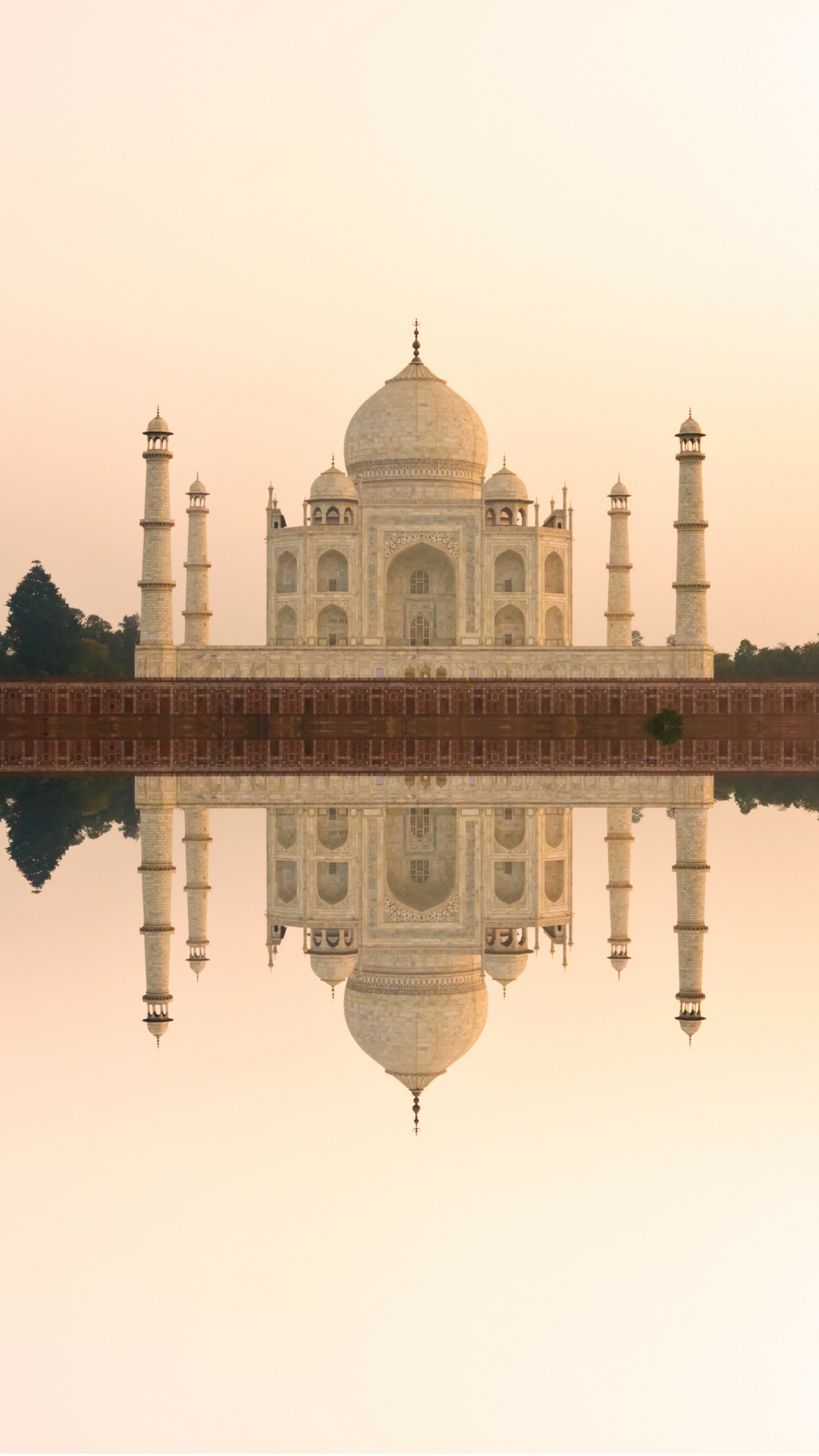 India: An immense mausoleum of white marble, built in Agra between 1631 and 1648. 2160x3840 4K Background.