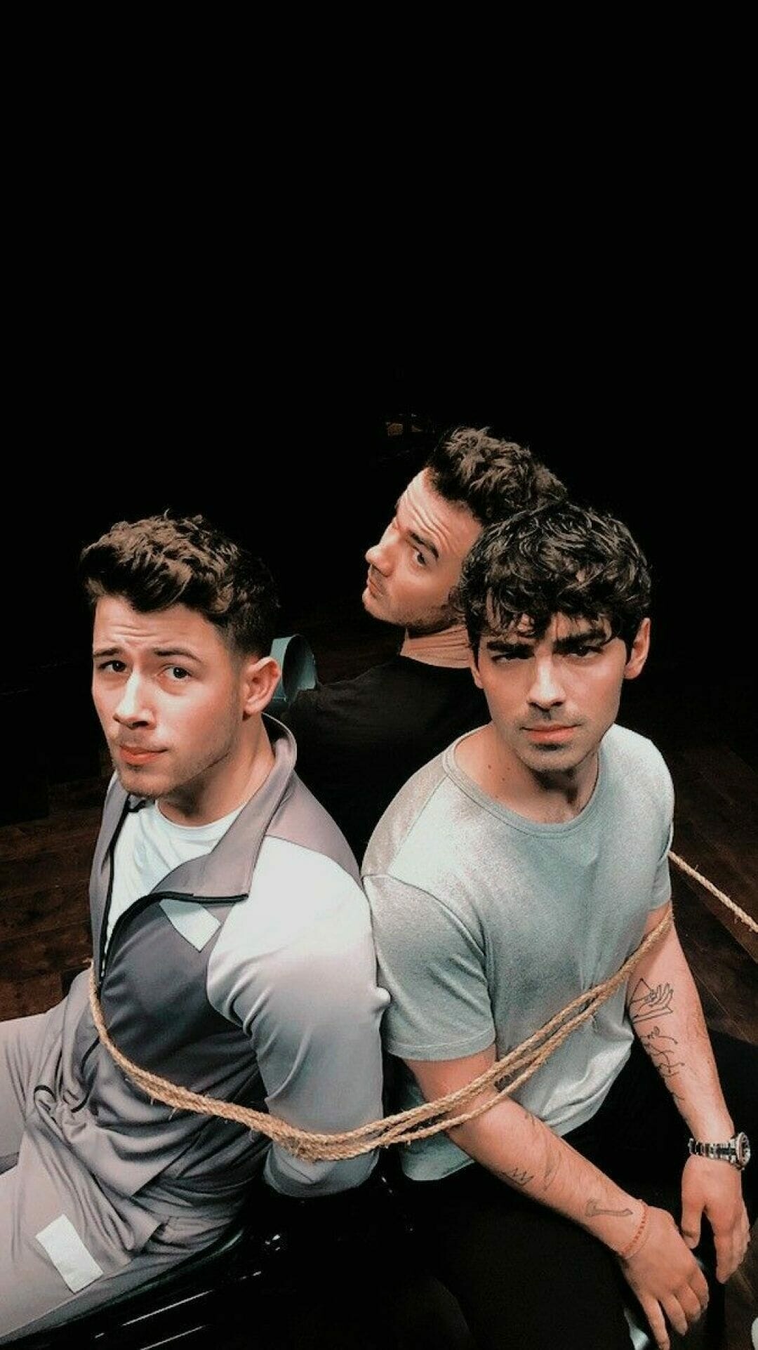 Jonas Brothers: A Little Bit Longer was preceded by three singles, "Burnin' Up", "Lovebug" and "Tonight". 1080x1930 HD Background.