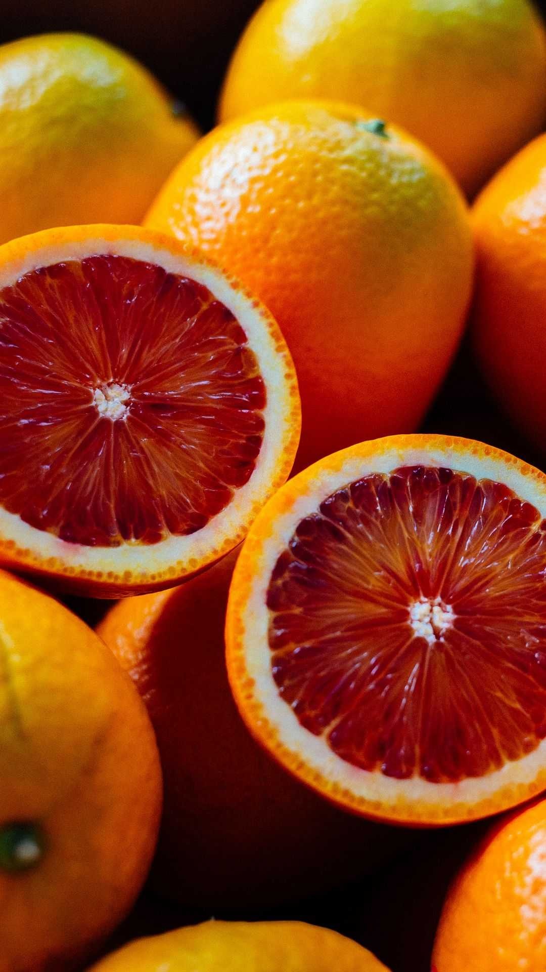 Orange: Consists of juice vesicles surrounded by a waxy skin, the peel. 1080x1920 Full HD Background.