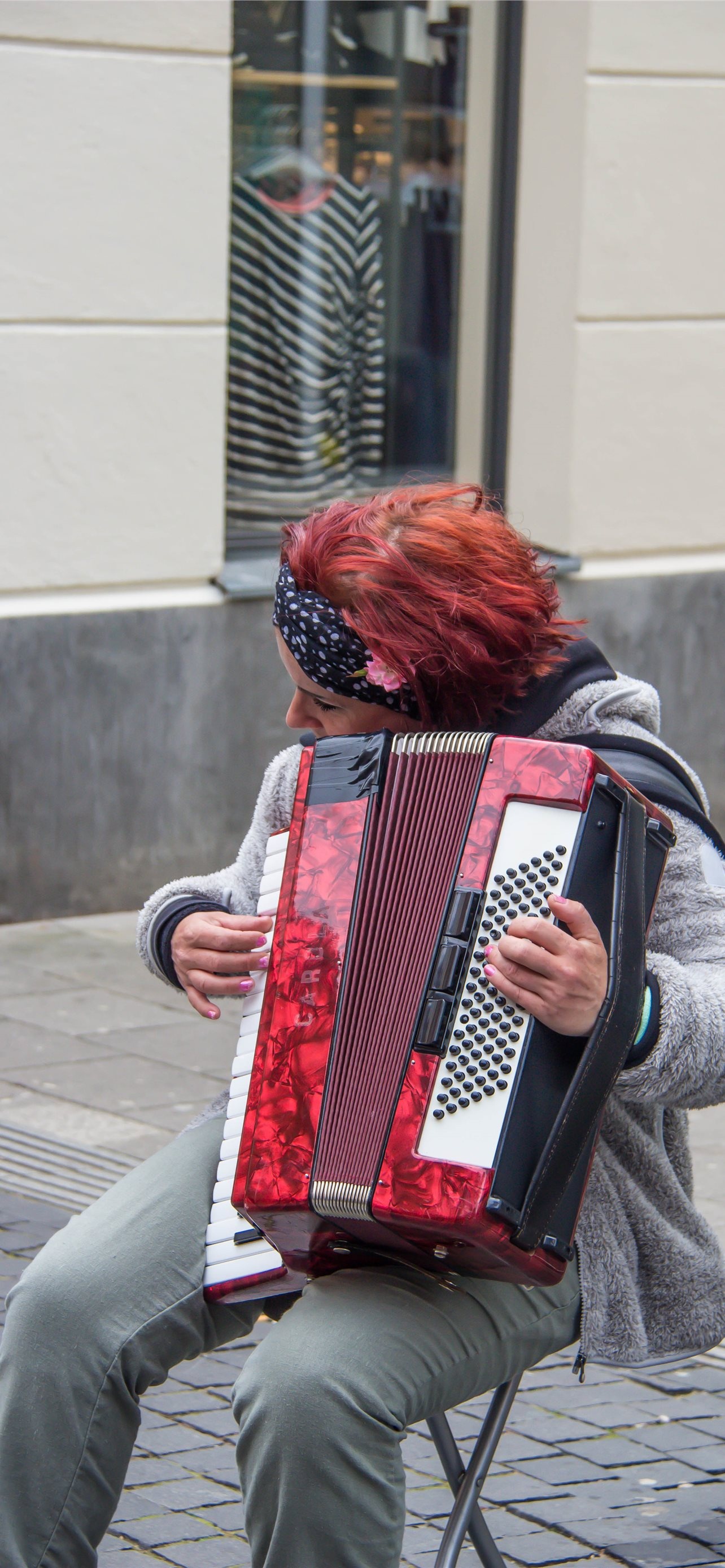 Accordion: Street musician, Playing live, Compressing and expanding the bellows. 1290x2780 HD Wallpaper.