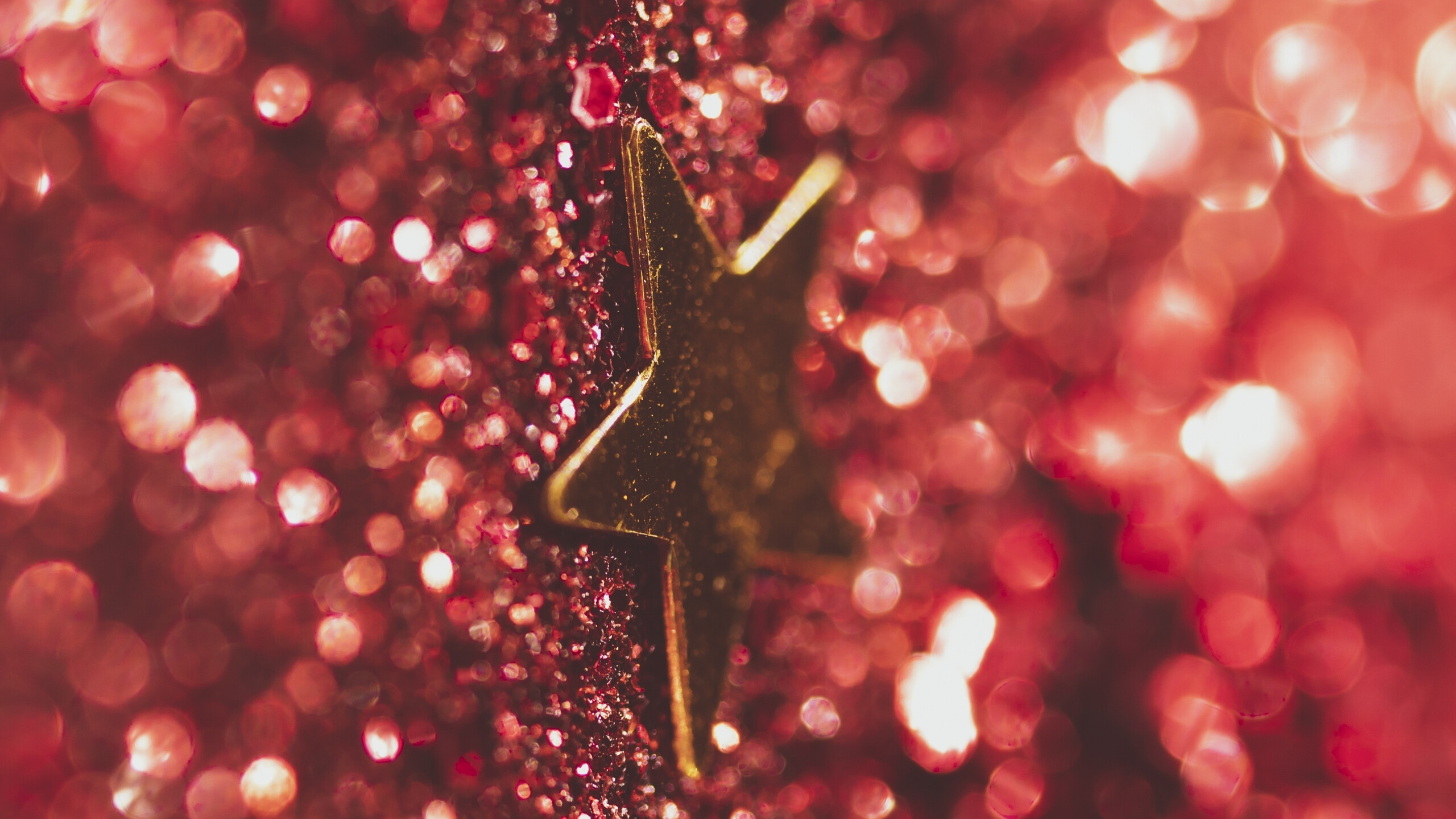 Gold Star: Glitter star-shaped decoration for Christmas, Bokeh red, Perfect for party decorations. 2560x1440 HD Background.