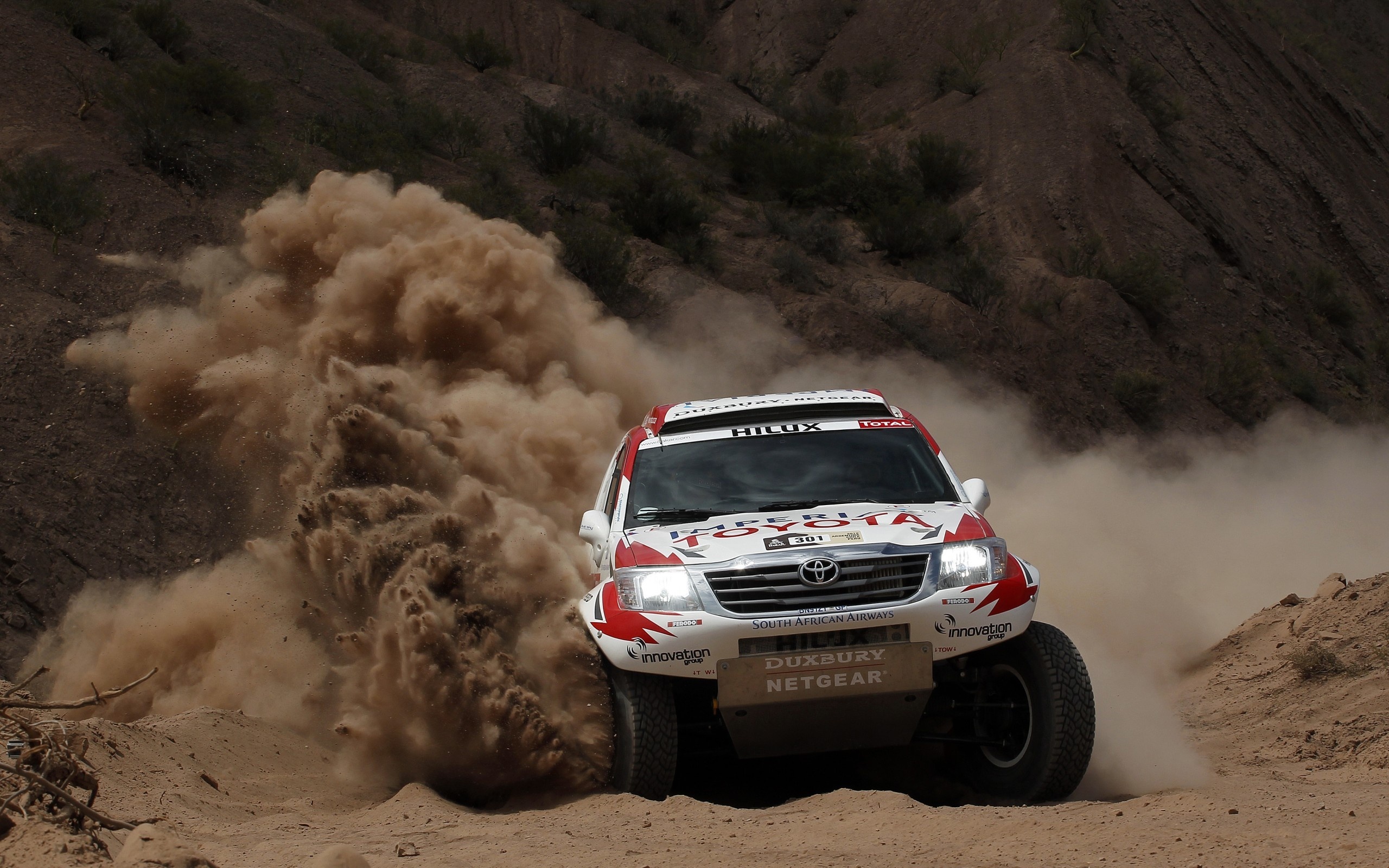 Dakar Rally: The Toyota Hilux Dakar, An off-road competition car, Four-wheel drive. 2560x1600 HD Wallpaper.
