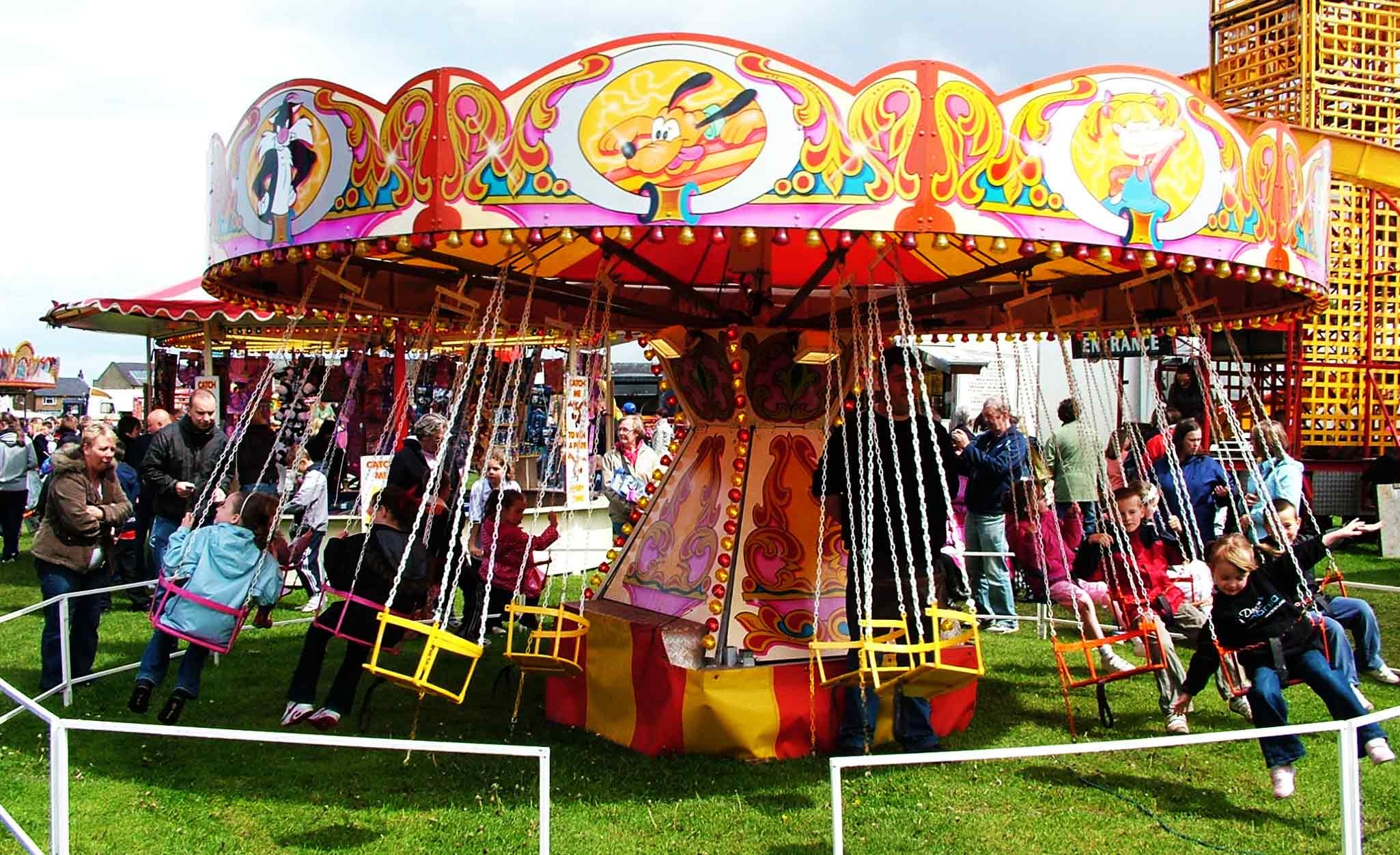 Fun Fair: A carnival having various devices for entertainment. 2050x1260 HD Background.