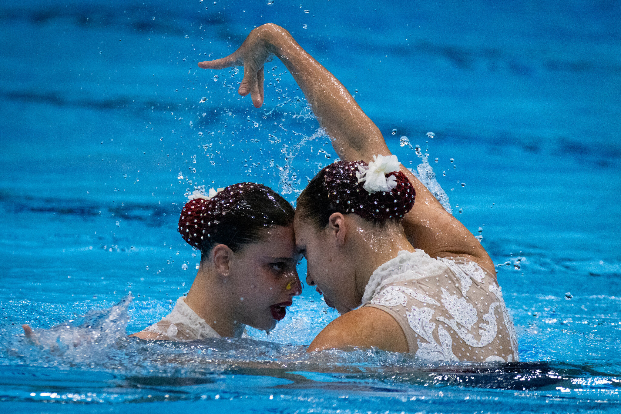 Synchronized Swimming: Girls perform during the women's duet event at the FINA water sports championship. 2050x1370 HD Background.