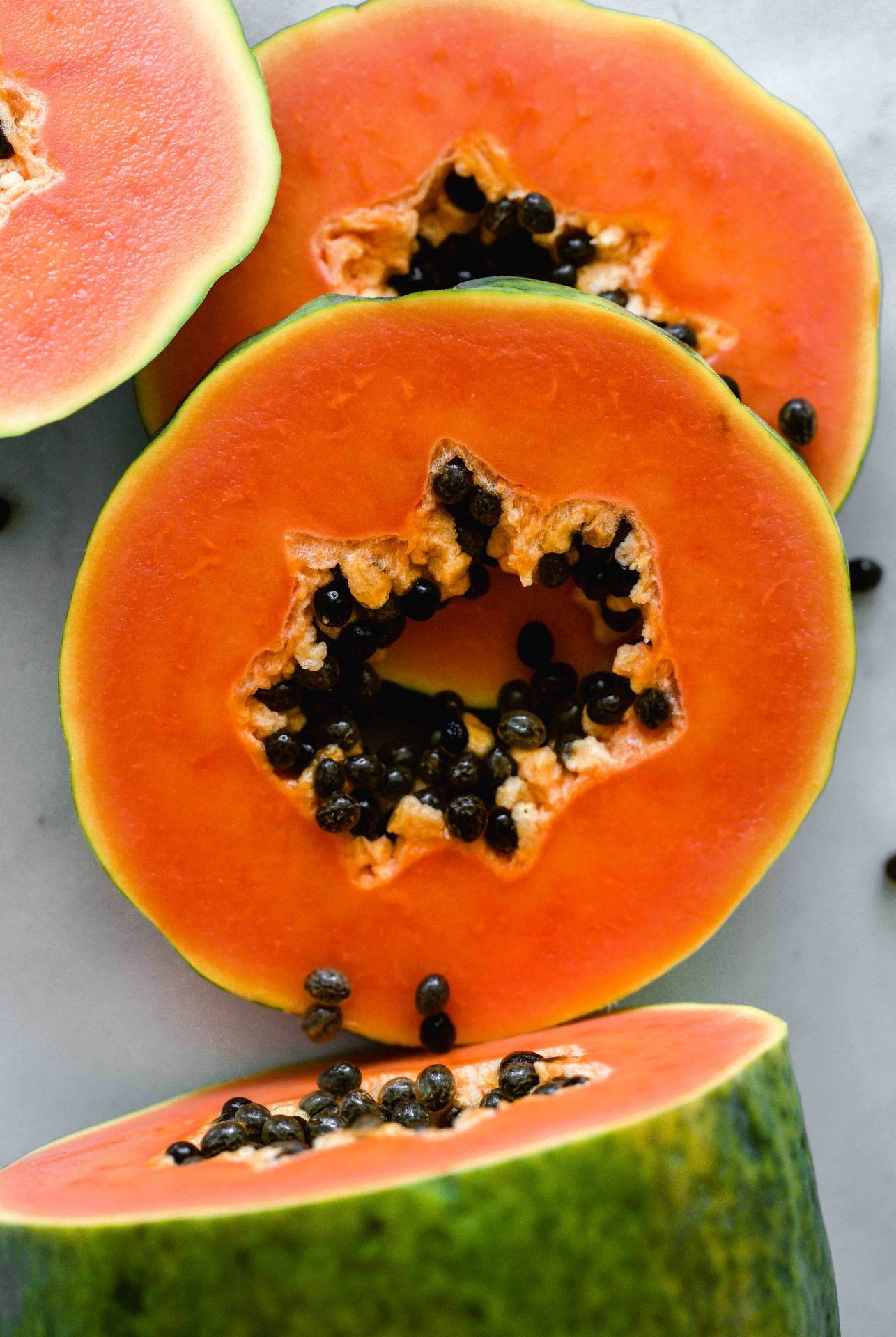 Papaya: Soft tropical fruit with a yellowish-orange color. 1290x1920 HD Background.