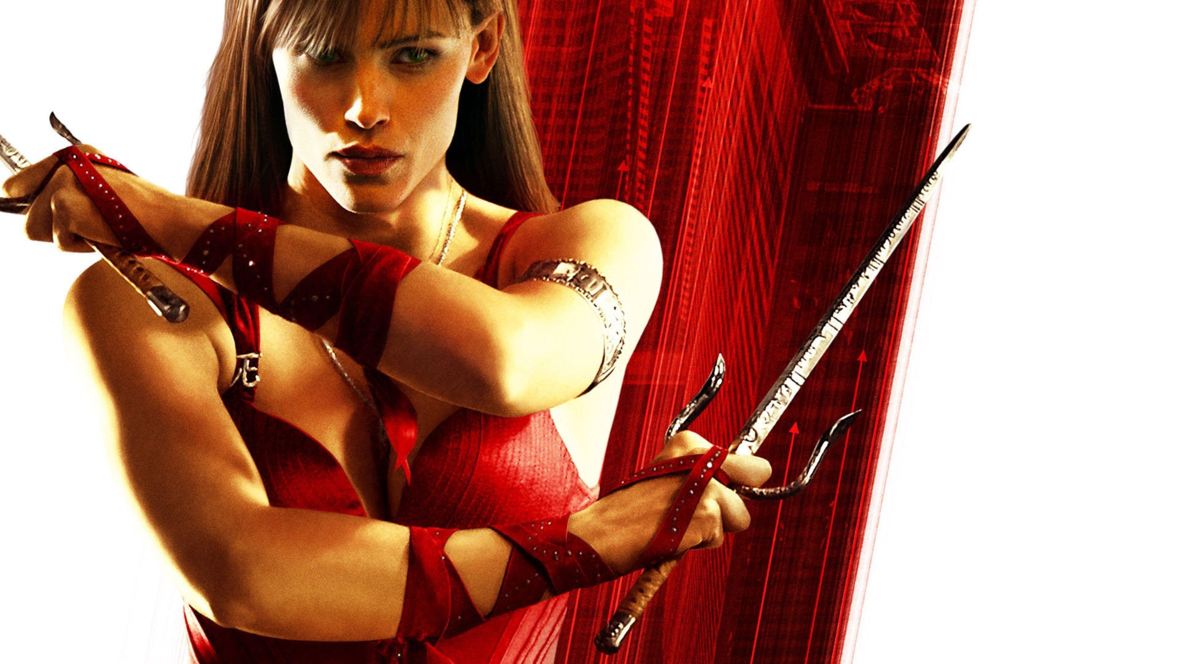 Elektra: A highly trained assassin, wields a pair of bladed sai as her trademark weapon. 3840x2160 4K Wallpaper.