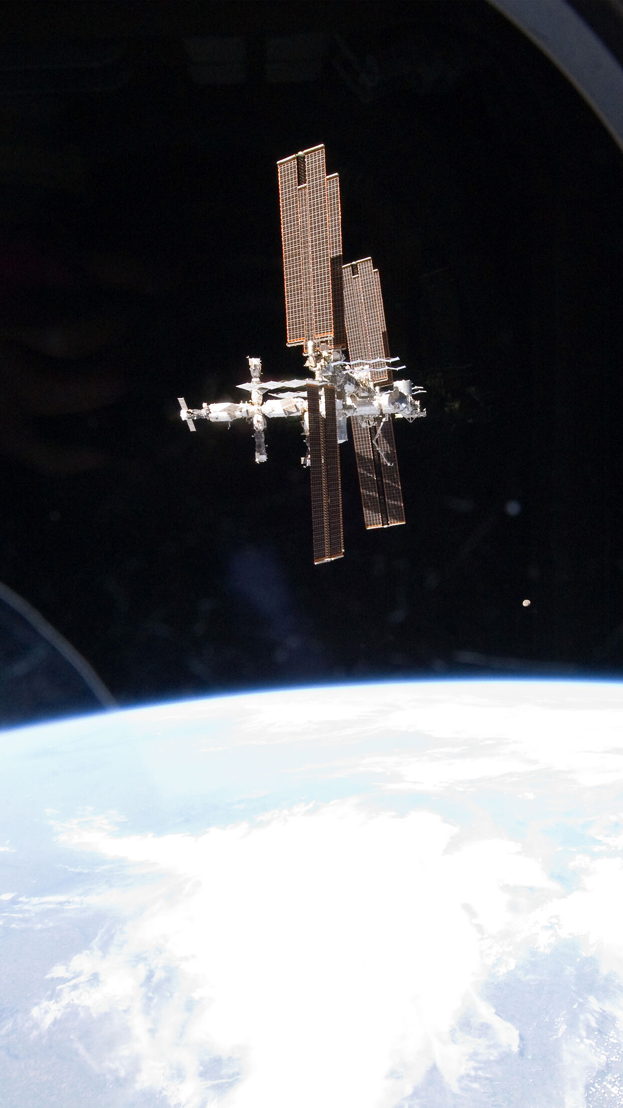 ISS: Circles the Earth in roughly 93 minutes, completing 15.5 orbits per day. 1250x2210 HD Background.