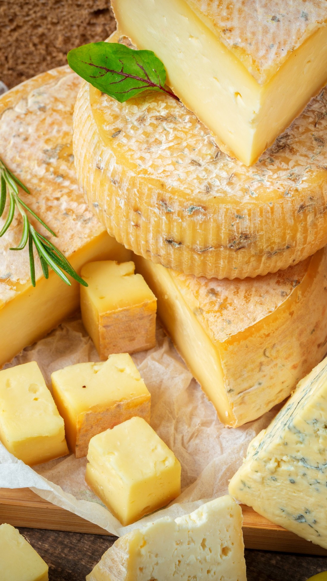 Cheese: Has aromatic molds on the rind, the outer layer, or throughout. 1080x1920 Full HD Background.