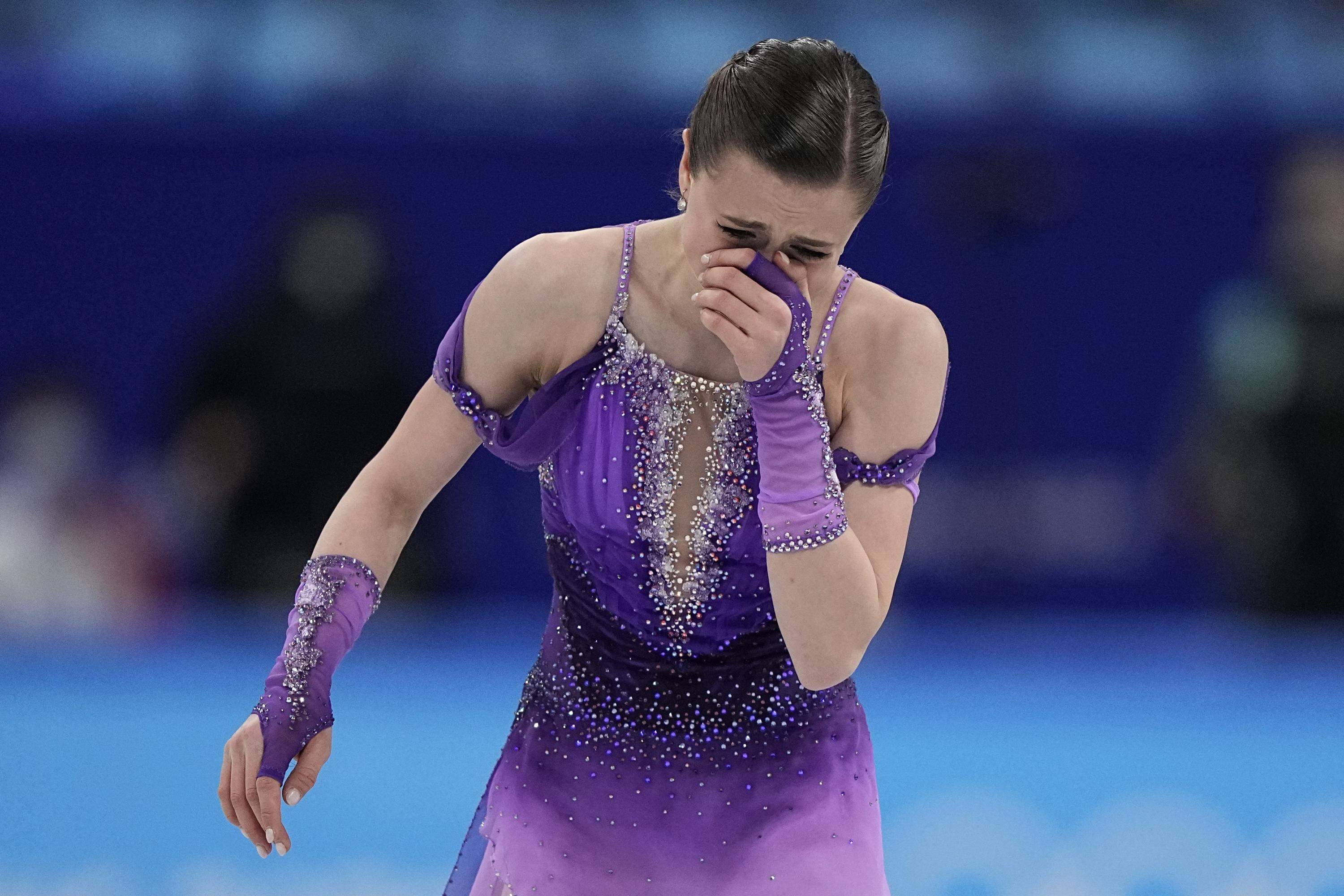 Single Skating: Kamila Valieva reacts in the women's short program during the figure skating at the 2022 Winter Olympics. 3000x2000 HD Background.