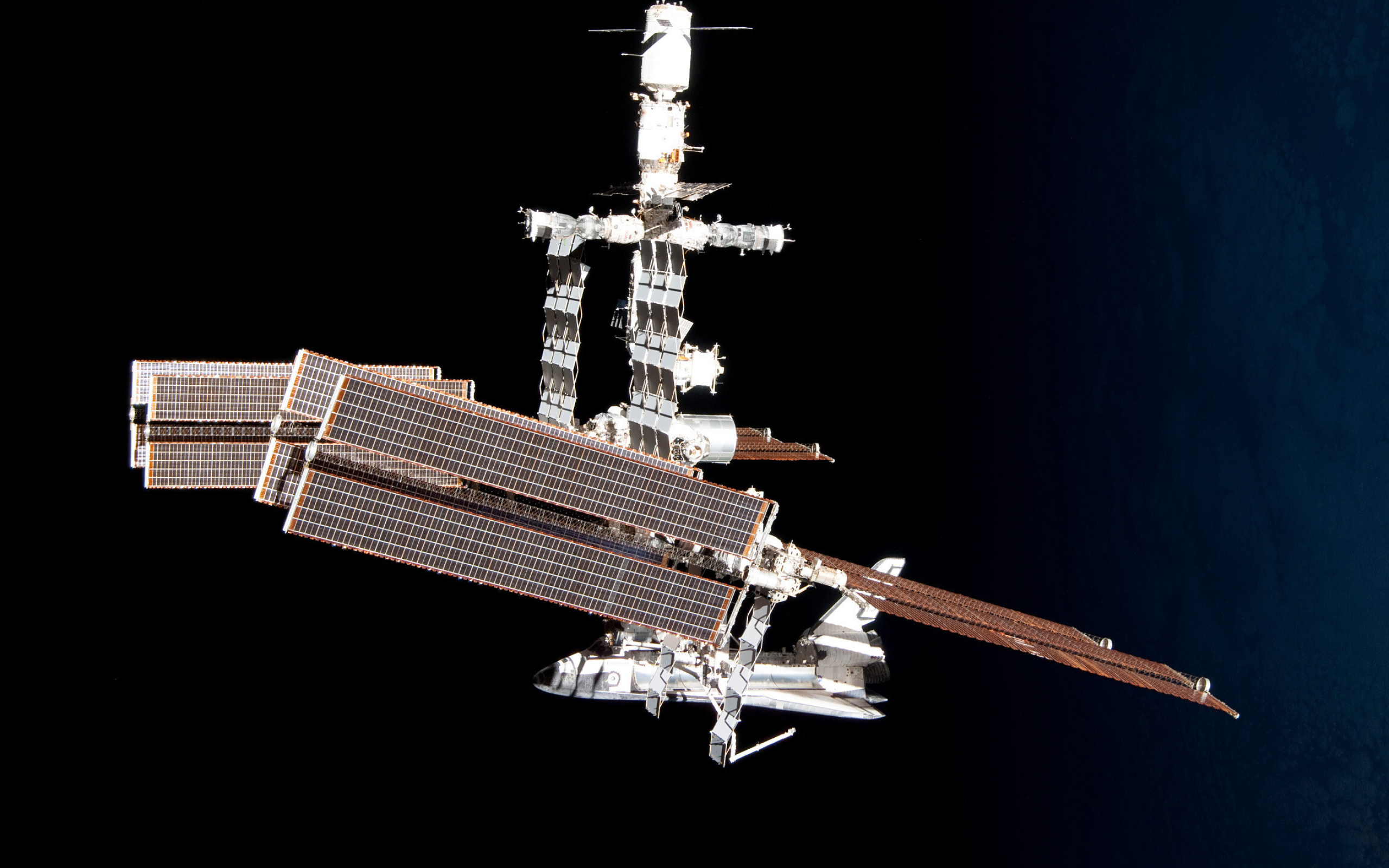 International Space Station: The first ISS component was launched in 1998, Low Earth orbit. 2560x1600 HD Background.