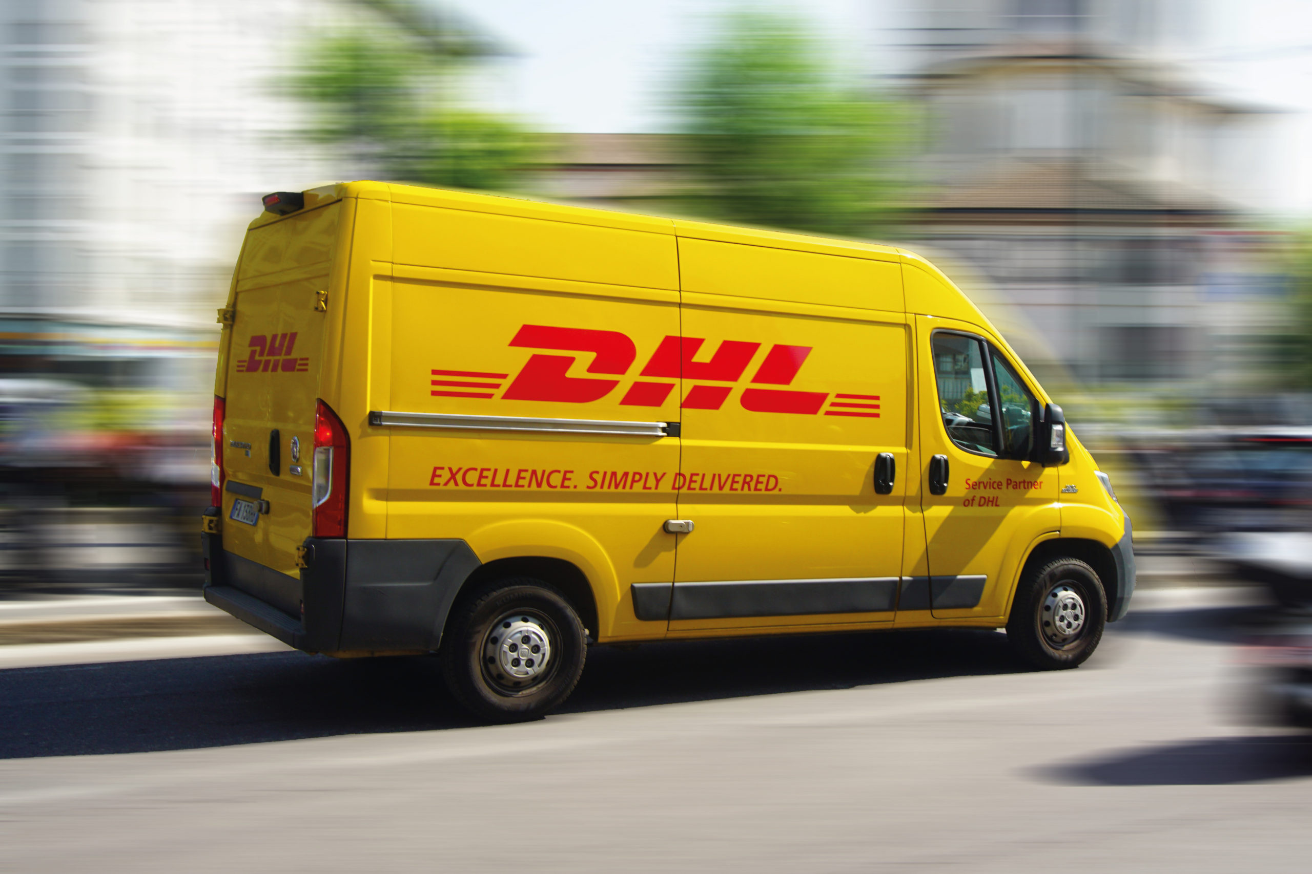 DHL: Express, The part of the Deutsche Post headquarters in Bonn, A branded vehicle. 2560x1710 HD Background.