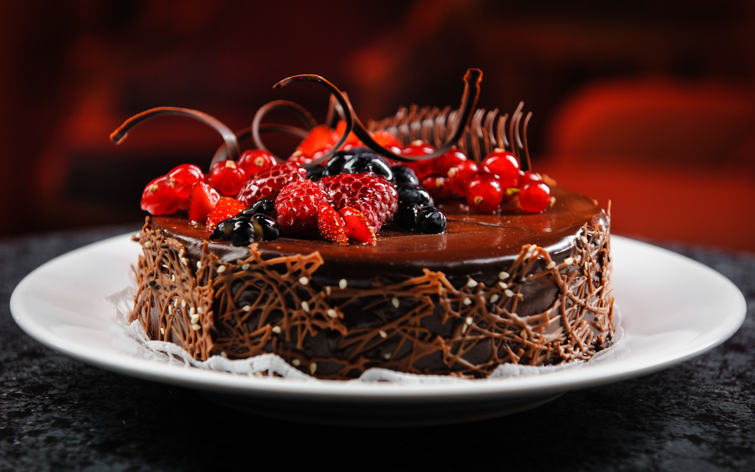 Cake: Packed with candied fruits, nuts, and spices, soaked in alcohol for enhanced flavor. 2560x1600 HD Background.