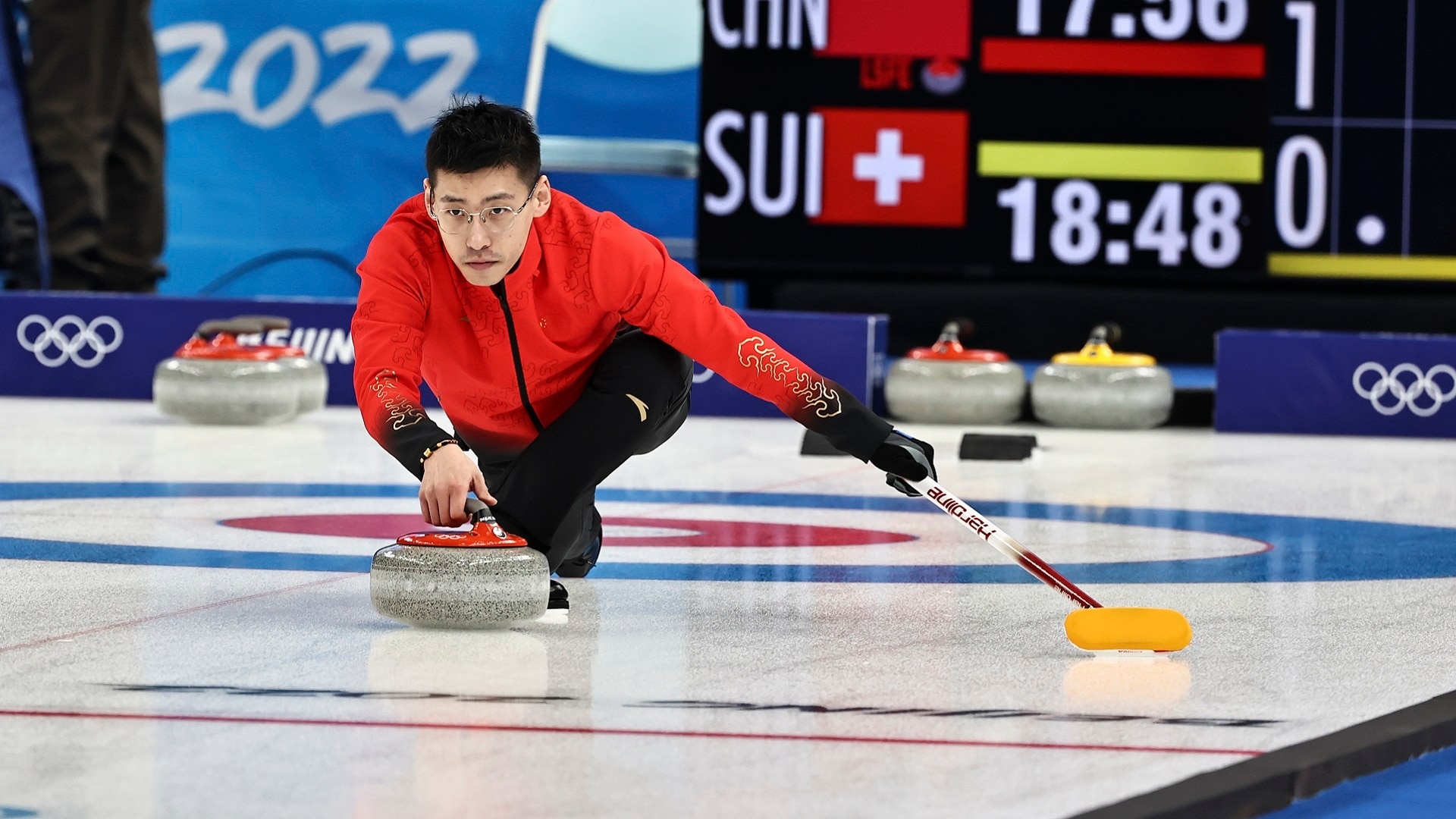 Curling: Ling Zhi of Team China competes during the Mixed Doubles Round Robin of the 2022 Winter Olympics. 1920x1080 Full HD Background.