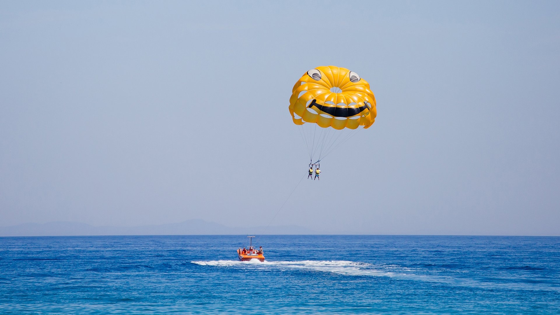 Parasailing: A fun experience, Reaching the destination height, A parasail wing, Kekova Island, Turkey. 1920x1080 Full HD Background.