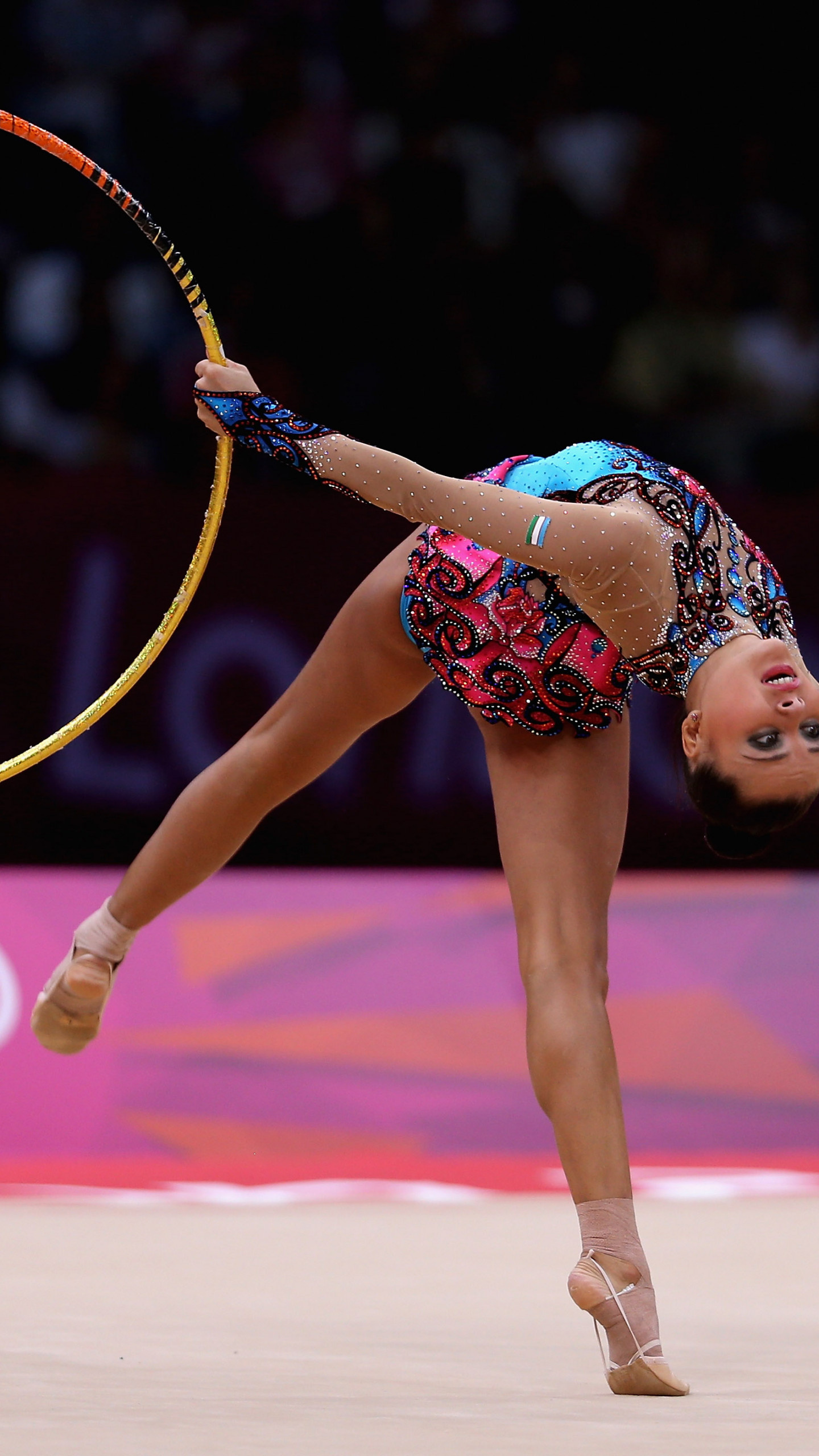 Rhythmic gymnastics spectacle, Widescreen wallpaper, Athletic feat, Dynamic imagery, 1440x2560 HD Phone