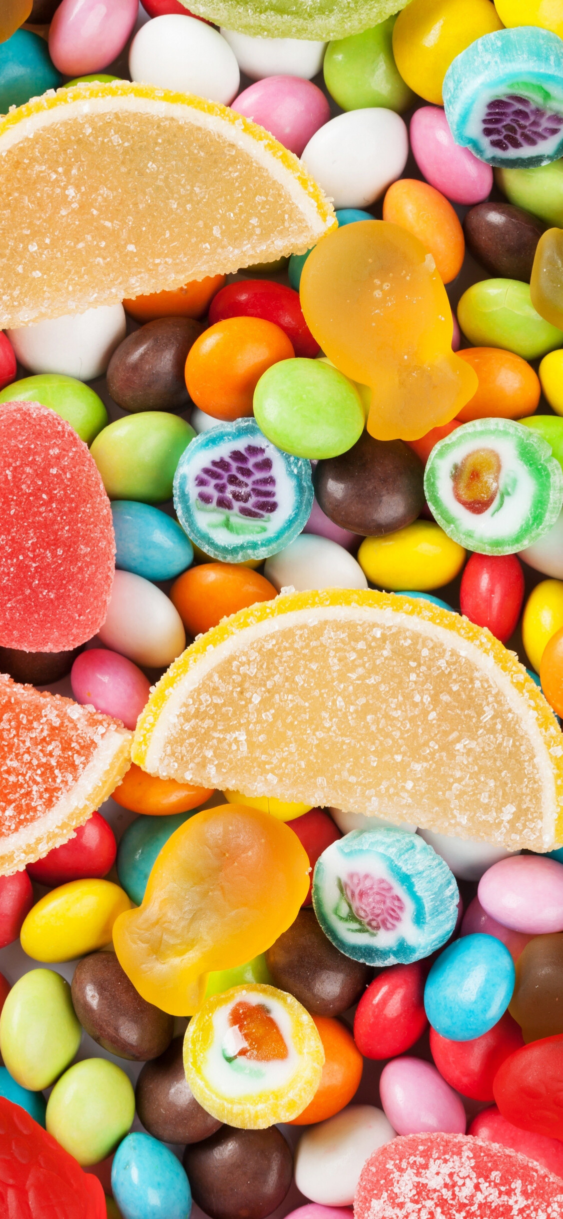Sweets: Jelly fruits slices, Skittles, Gummies, Assorted candies. 1130x2440 HD Wallpaper.