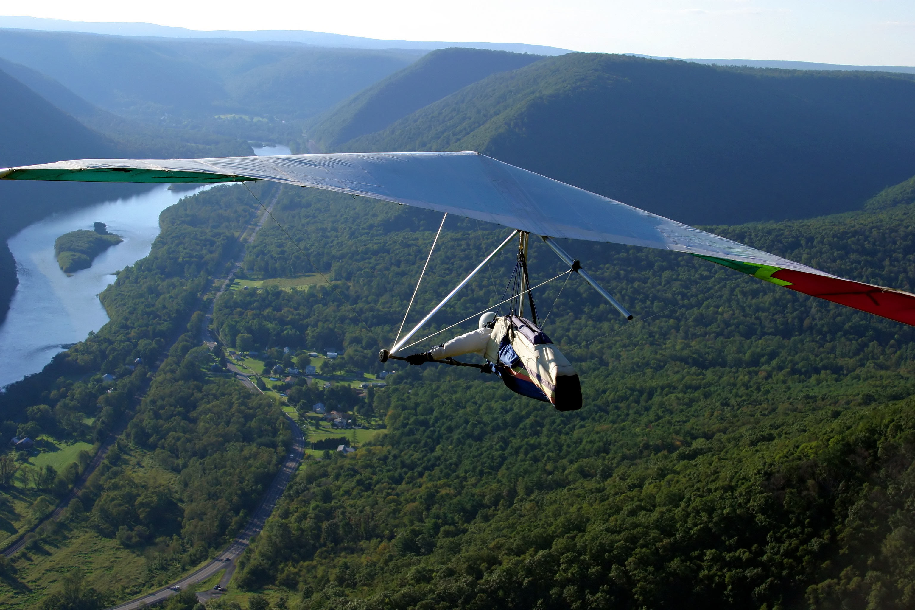 Hang Gliding: Soaring high above beautiful valley, Flying like a bird. 3080x2050 HD Background.