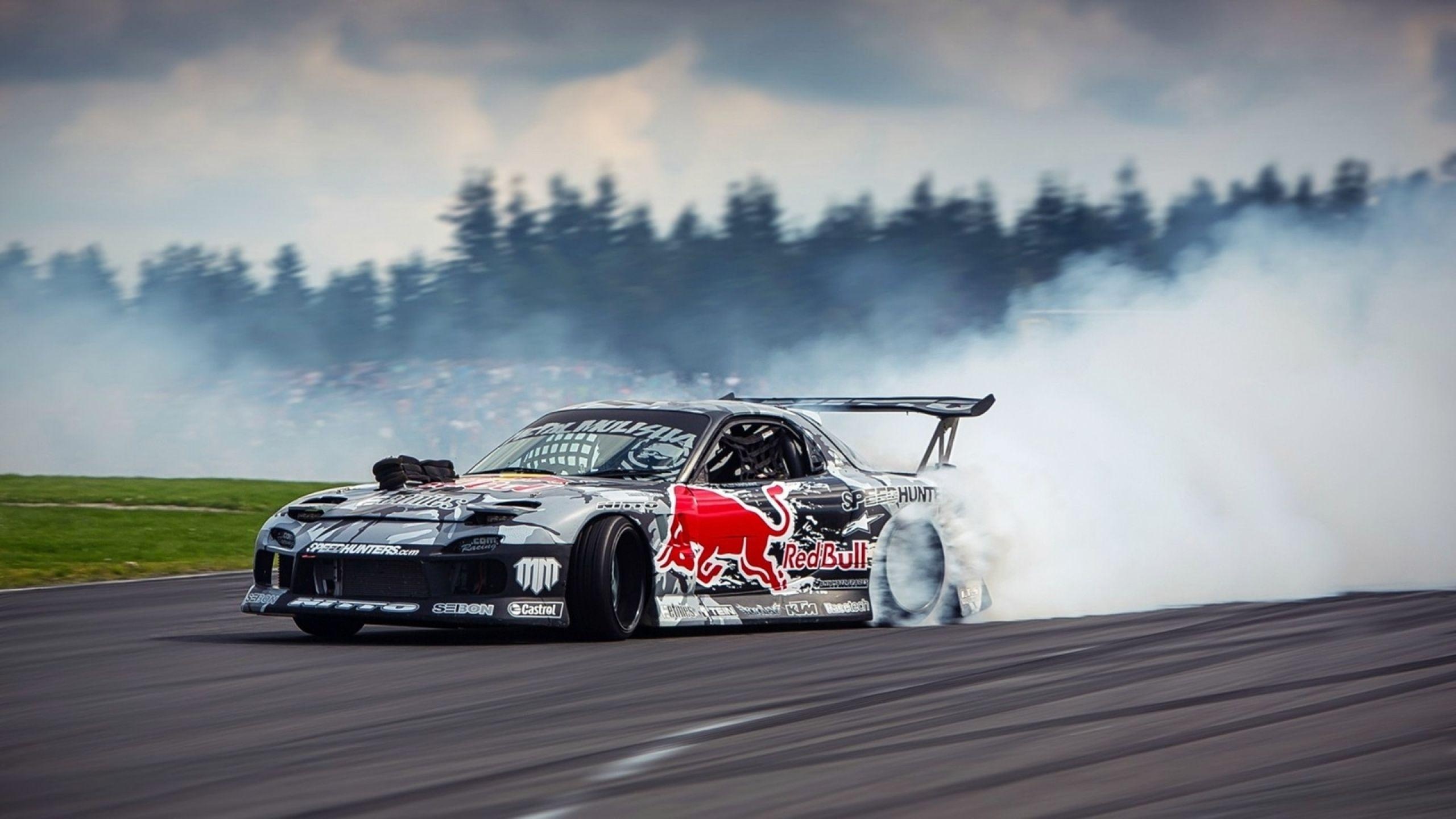 Drifting: Mazda RX-7 on a racing track, Red Bull Drifting World Championship. 2560x1440 HD Background.