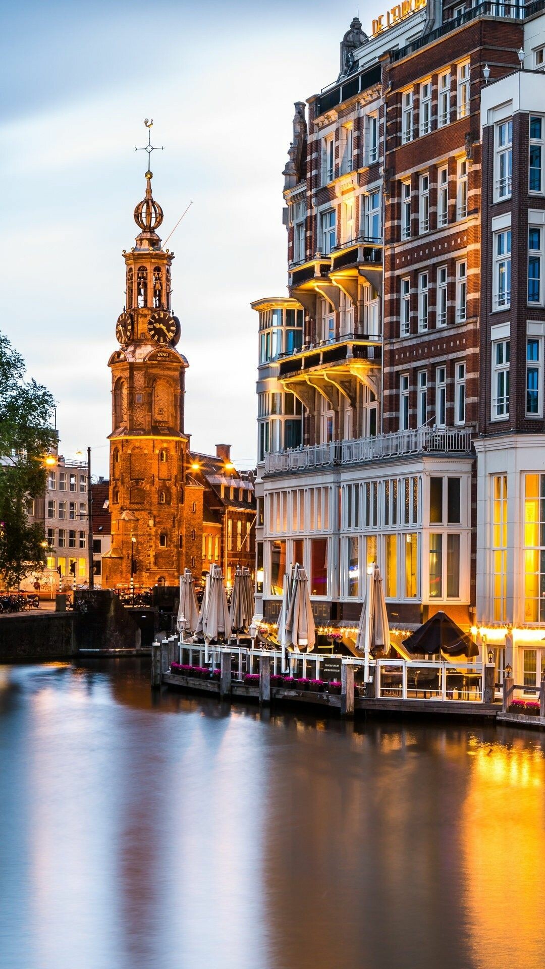 Amsterdam: Muntplein square, Munttoren, The Amstel river. 1080x1920 Full HD Wallpaper.