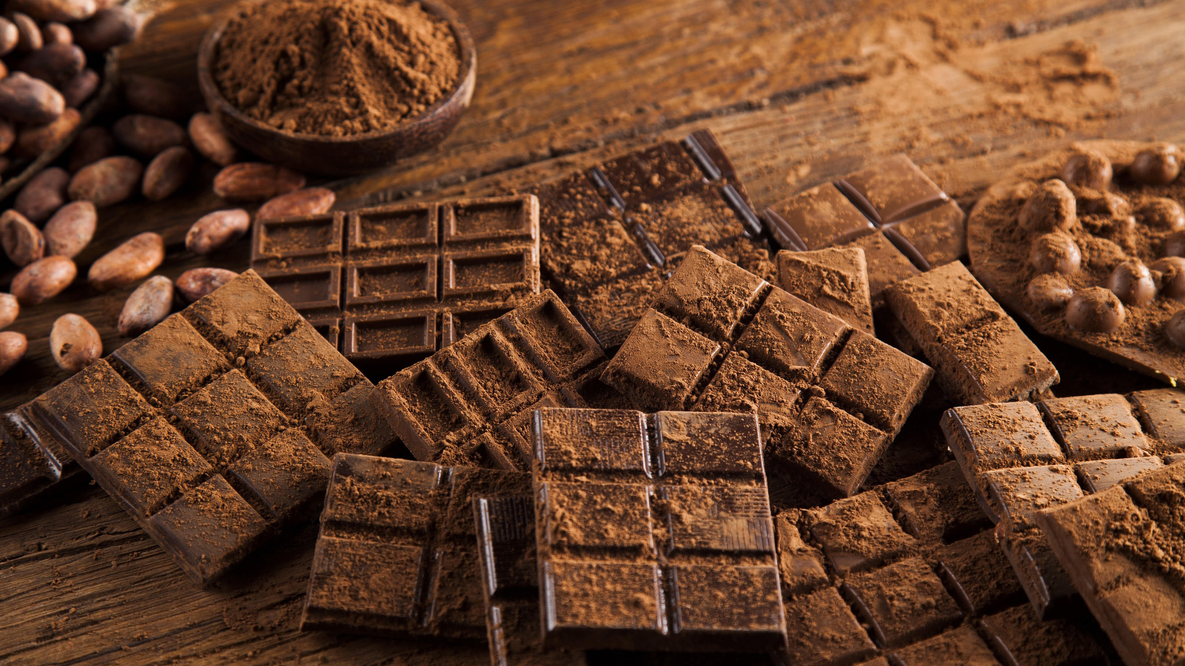 Chocolate: Food made from roasted and ground cacao seed kernels. 3840x2160 4K Background.
