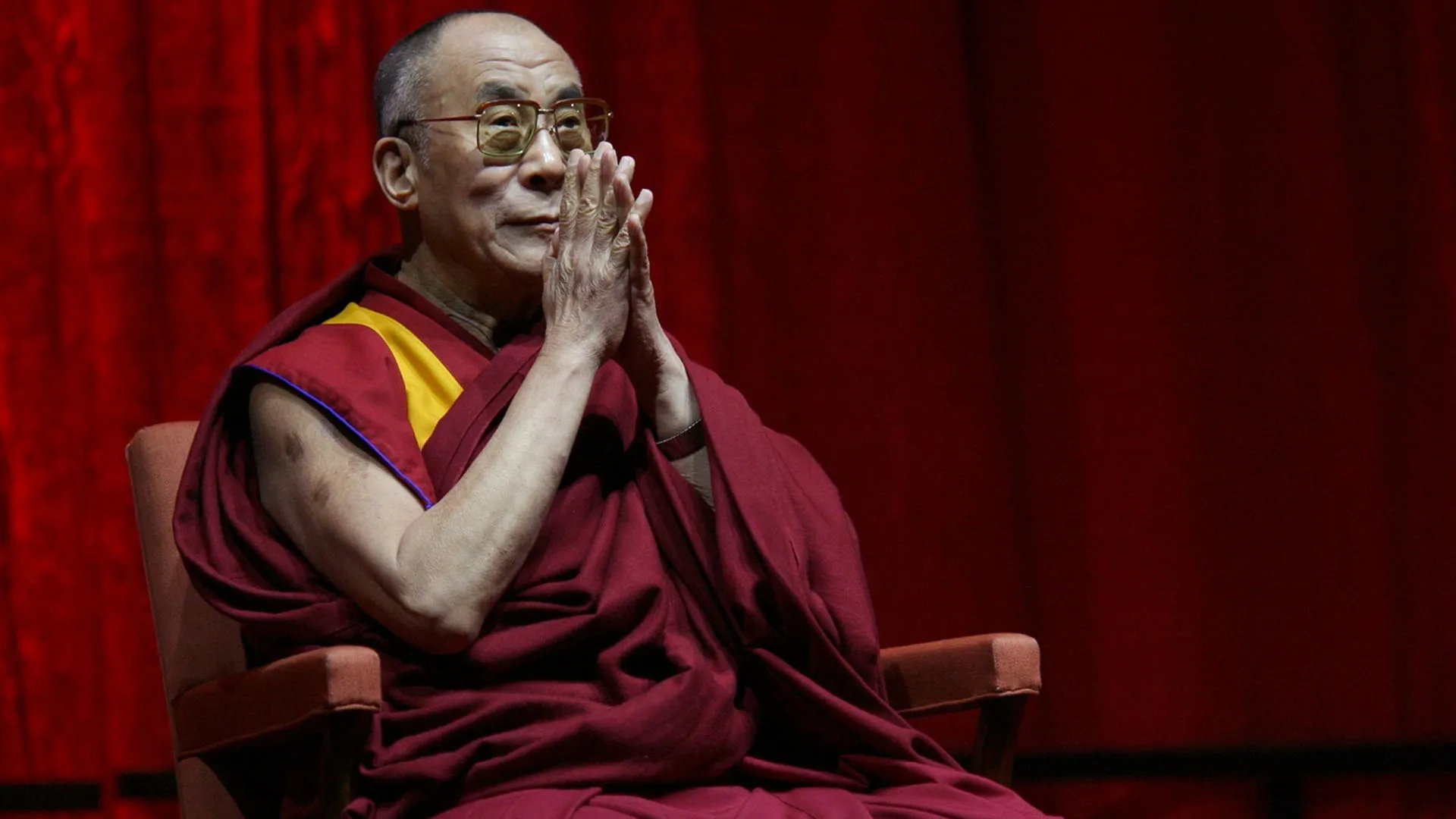 Dalai Lama: Has often been described as a "living Buddha" or a "bodhisattva". 1920x1080 Full HD Background.