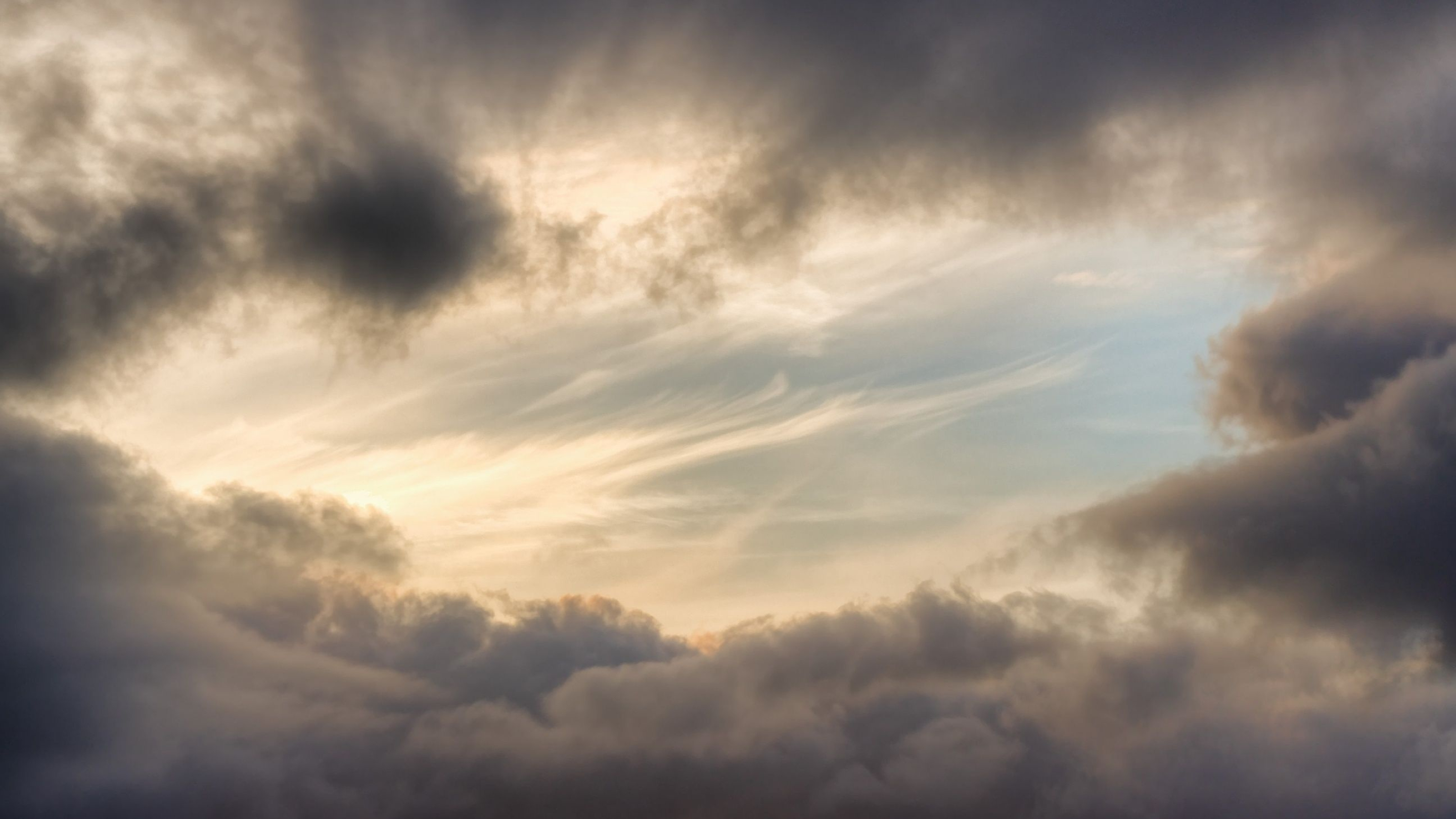 Gray Cloudy Sky: The scattering of sunlight, Glimpse of the sun, Atmospheric layer. 2880x1620 HD Background.