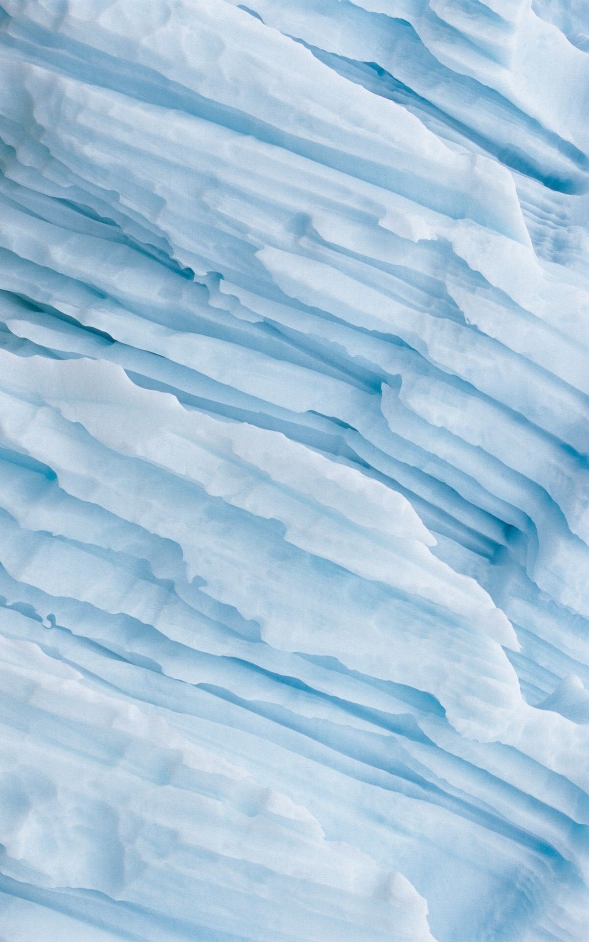 Glacier: A mass of ice of atmospheric origin experiencing viscoplastic flow under the action of gravity. 1200x1920 HD Background.