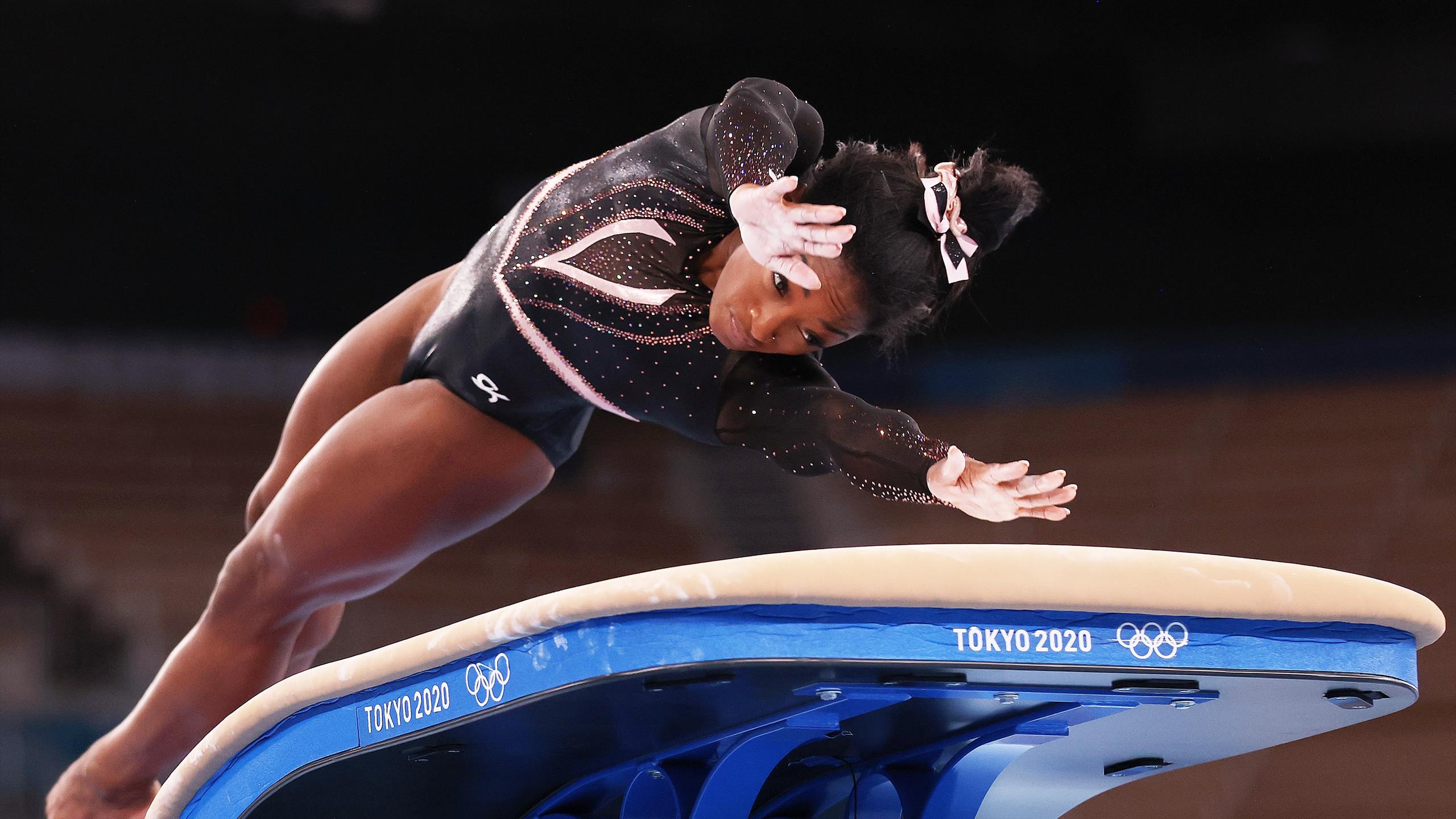 Vault (Gymnastics): Simone Biles, A five-time World all-around champion, Tokyo 2020 Summer Olympics bronze medalist. 2560x1440 HD Background.