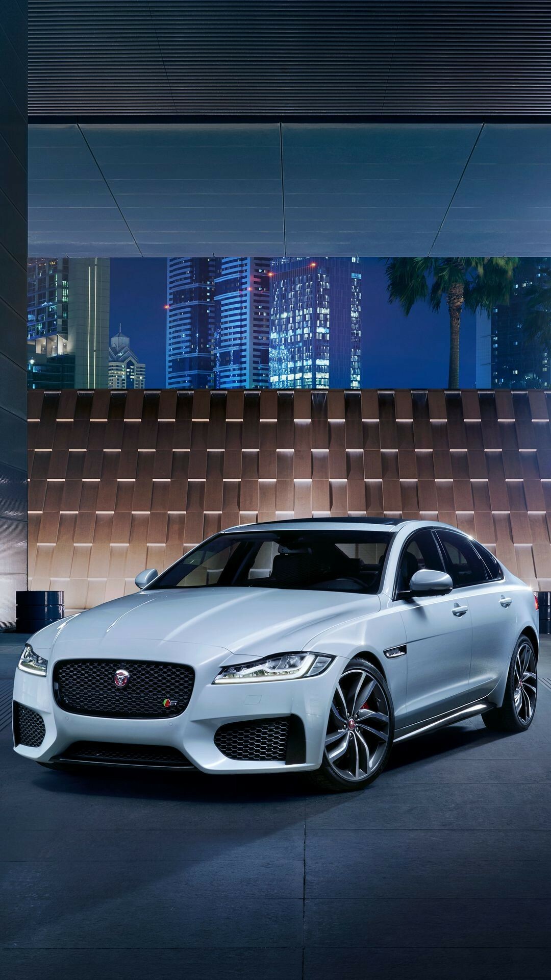 Jaguar Cars: Automaker, Known for luxurious sedans and athletic sports cars. 1080x1920 Full HD Background.