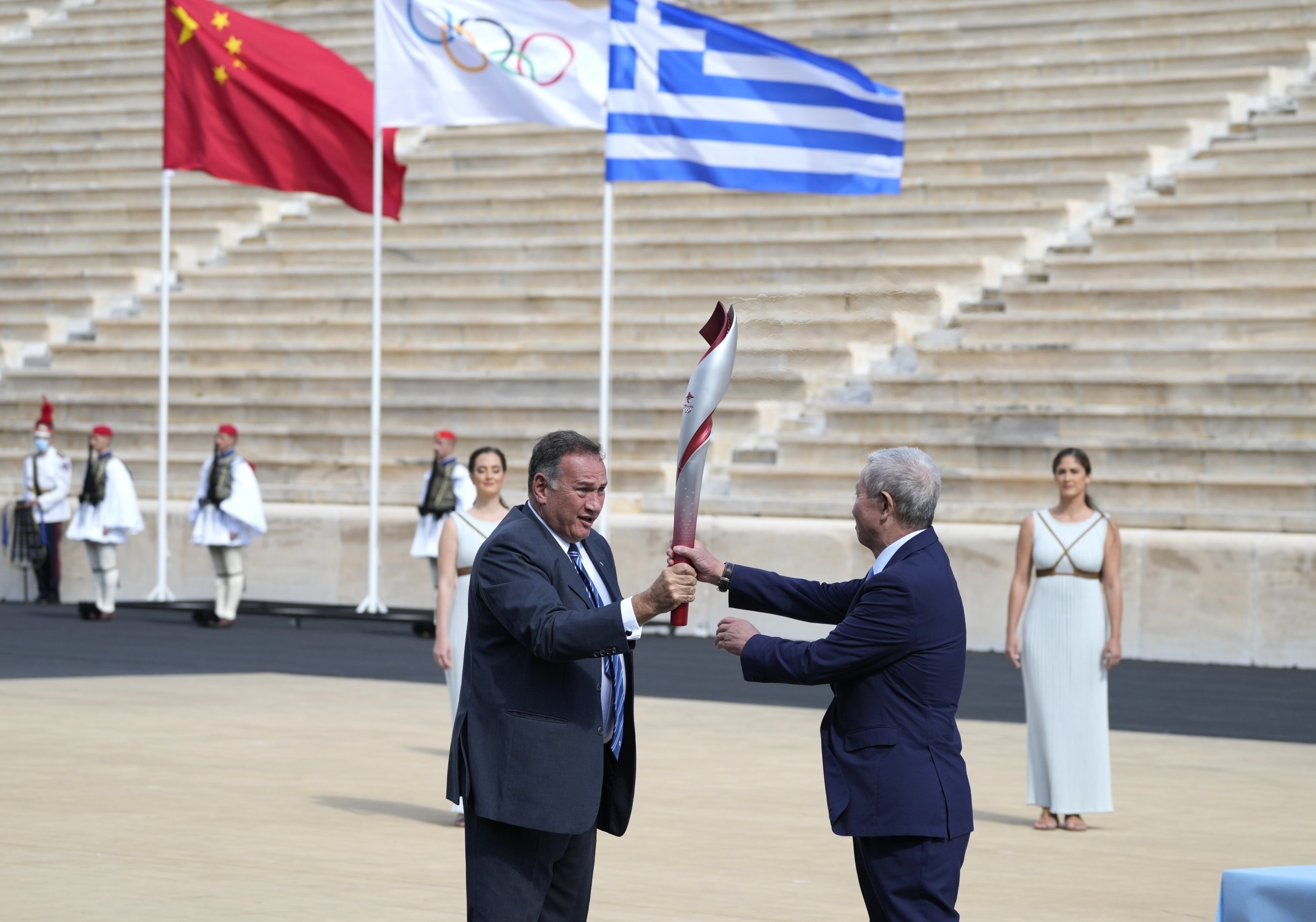 Olympic Flame: Spyros Kapralos, Vice-President of the Chinese Olympic Committee Yu Zaiqing, Panathinean stadium, Beijing Winter Games hosts. 3000x2110 HD Background.