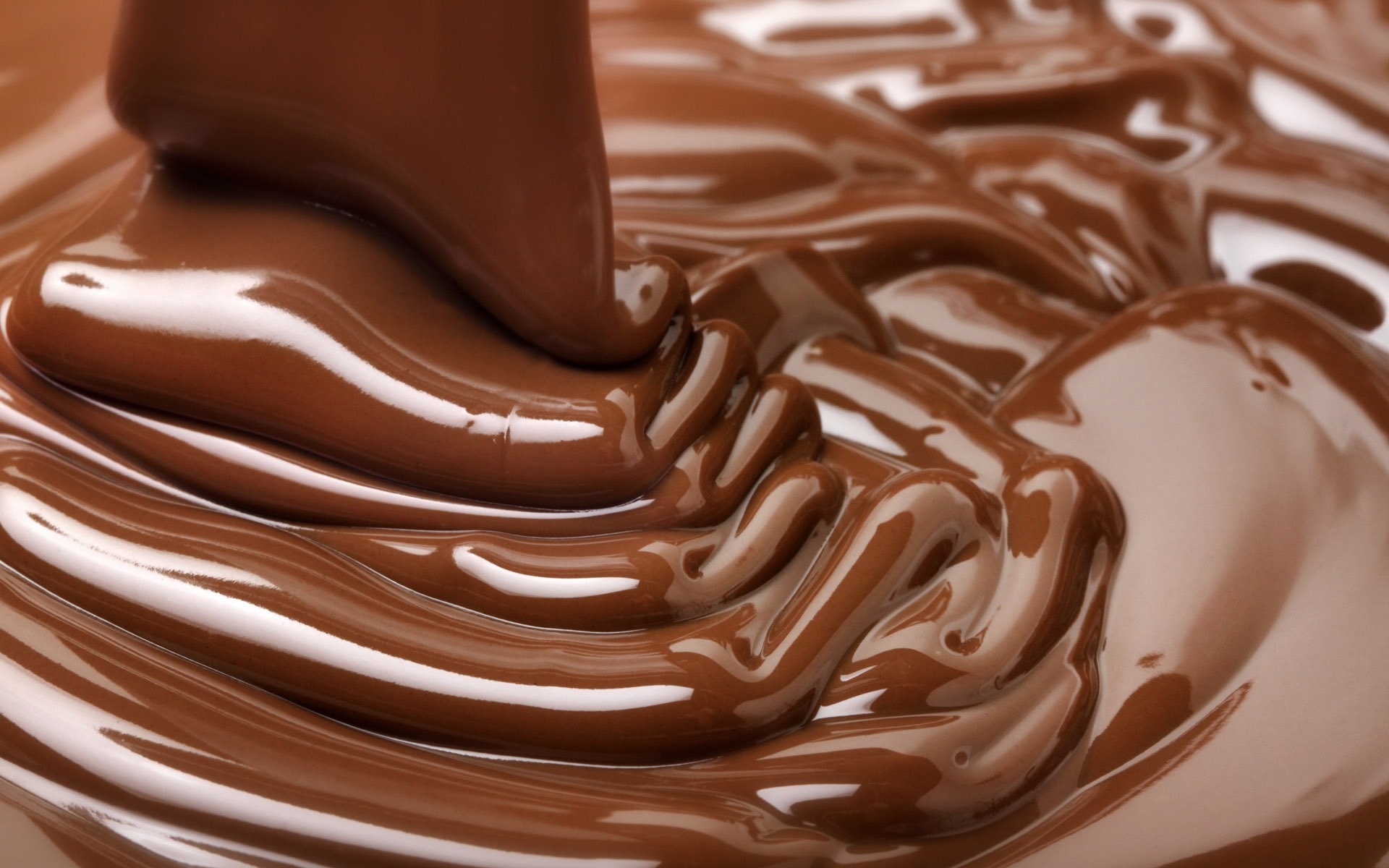 Chocolate: A suspension of cocoa solids, milk solids and sugar in cocoa butter. 1920x1200 HD Background.