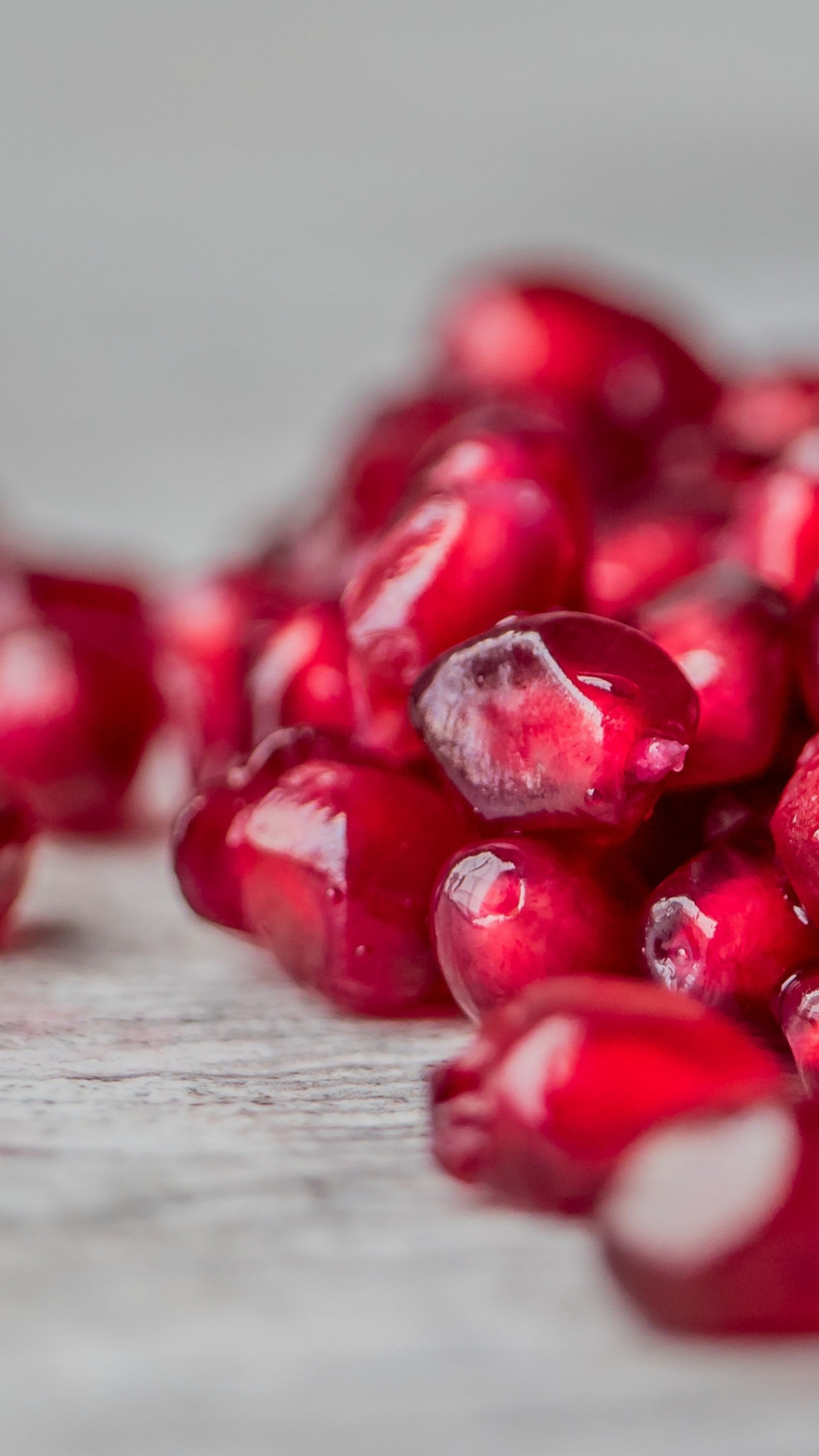 Seeds: Pomegranates, Packed with crunchy, juicy edible arils. 1080x1920 Full HD Background.