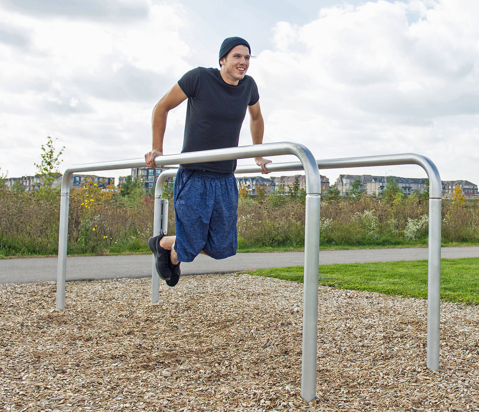 Parallel Bars: Parallel bars in playgrounds assist in the development of swinging maneuvers. 2000x1730 HD Background.