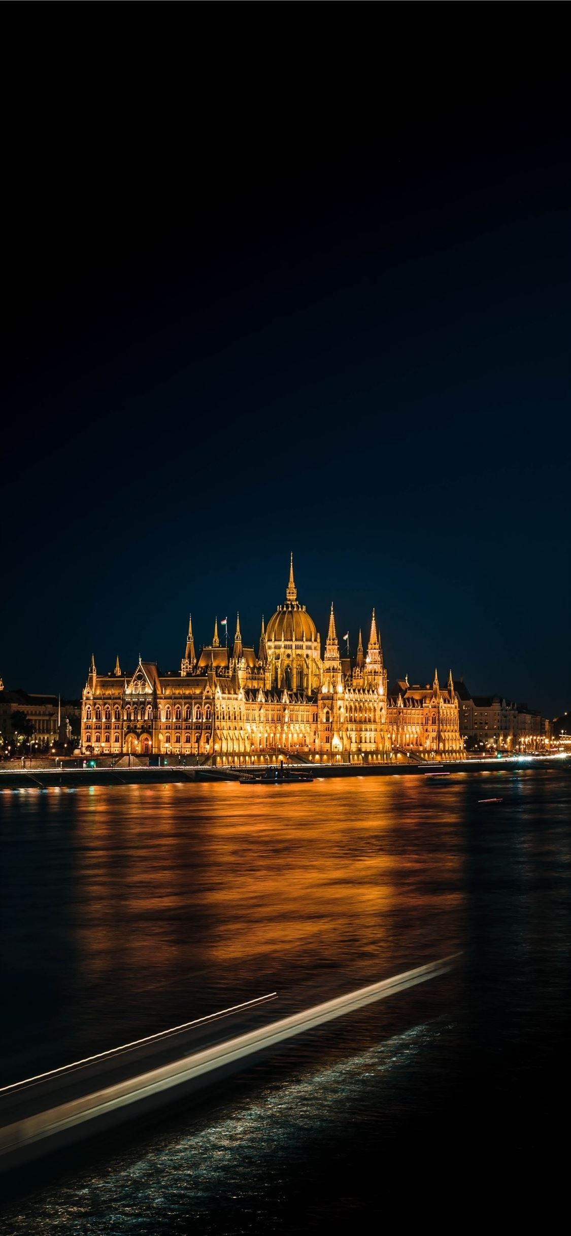 Budapest: The Parliament building built in a neo-Gothic style, Danube. 1130x2440 HD Wallpaper.