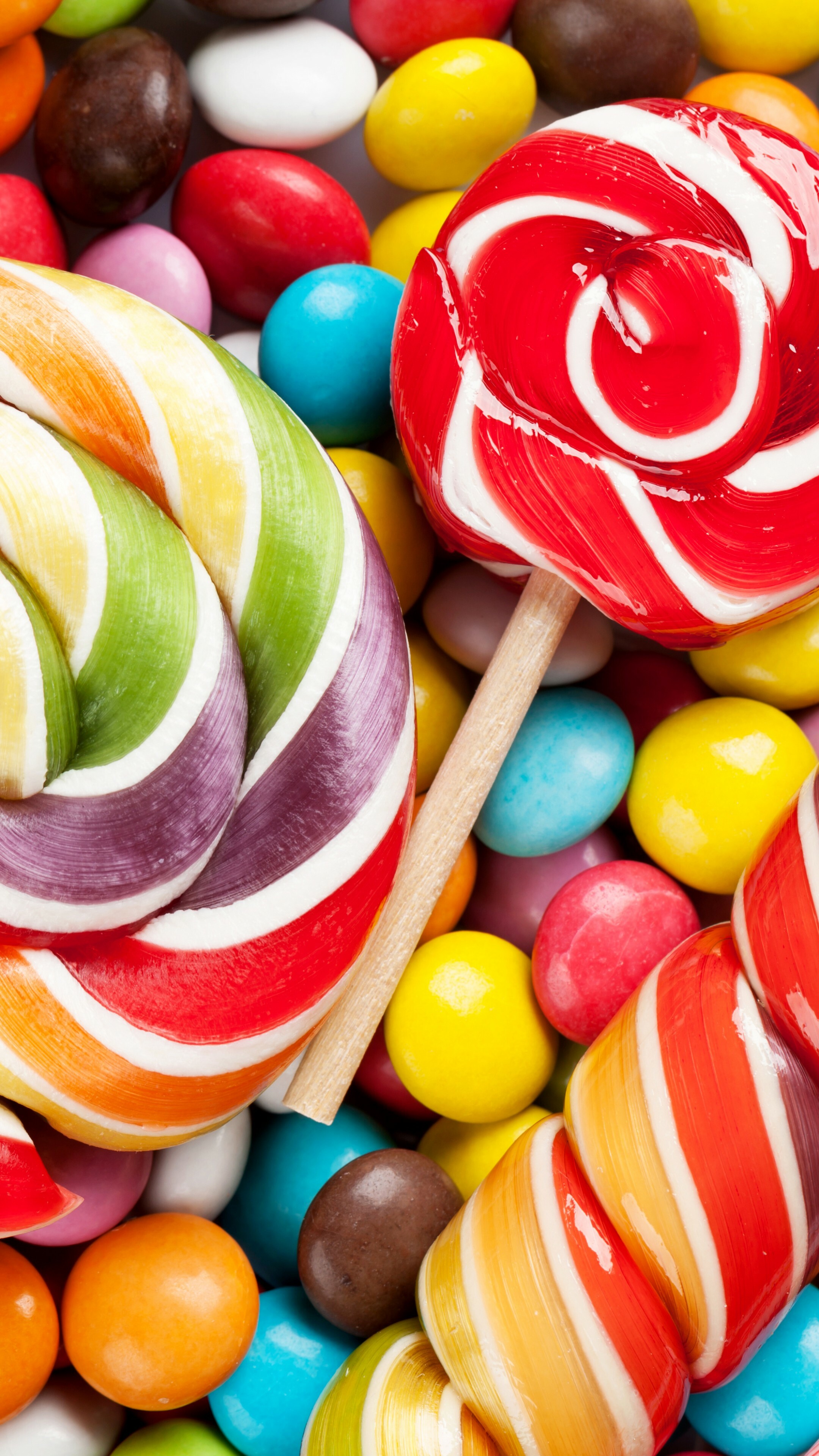 Sweets: Skittles, Multicolored fruit-flavored button-shaped candies, Lollipop. 2160x3840 4K Wallpaper.