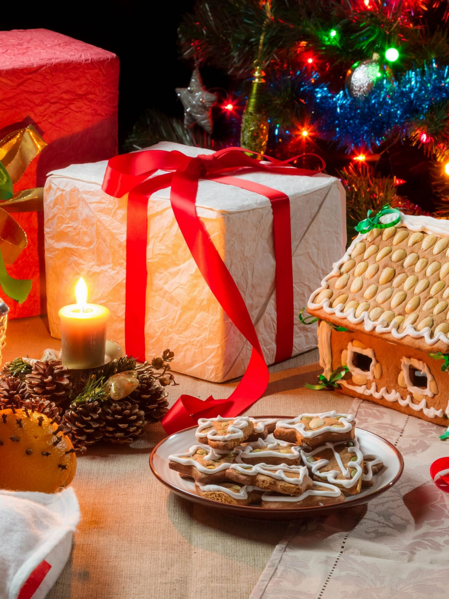 Gingerbread House: Winter wonderland, Christmas tree ornaments, Festive centerpiece, Candles. 1540x2050 HD Wallpaper.