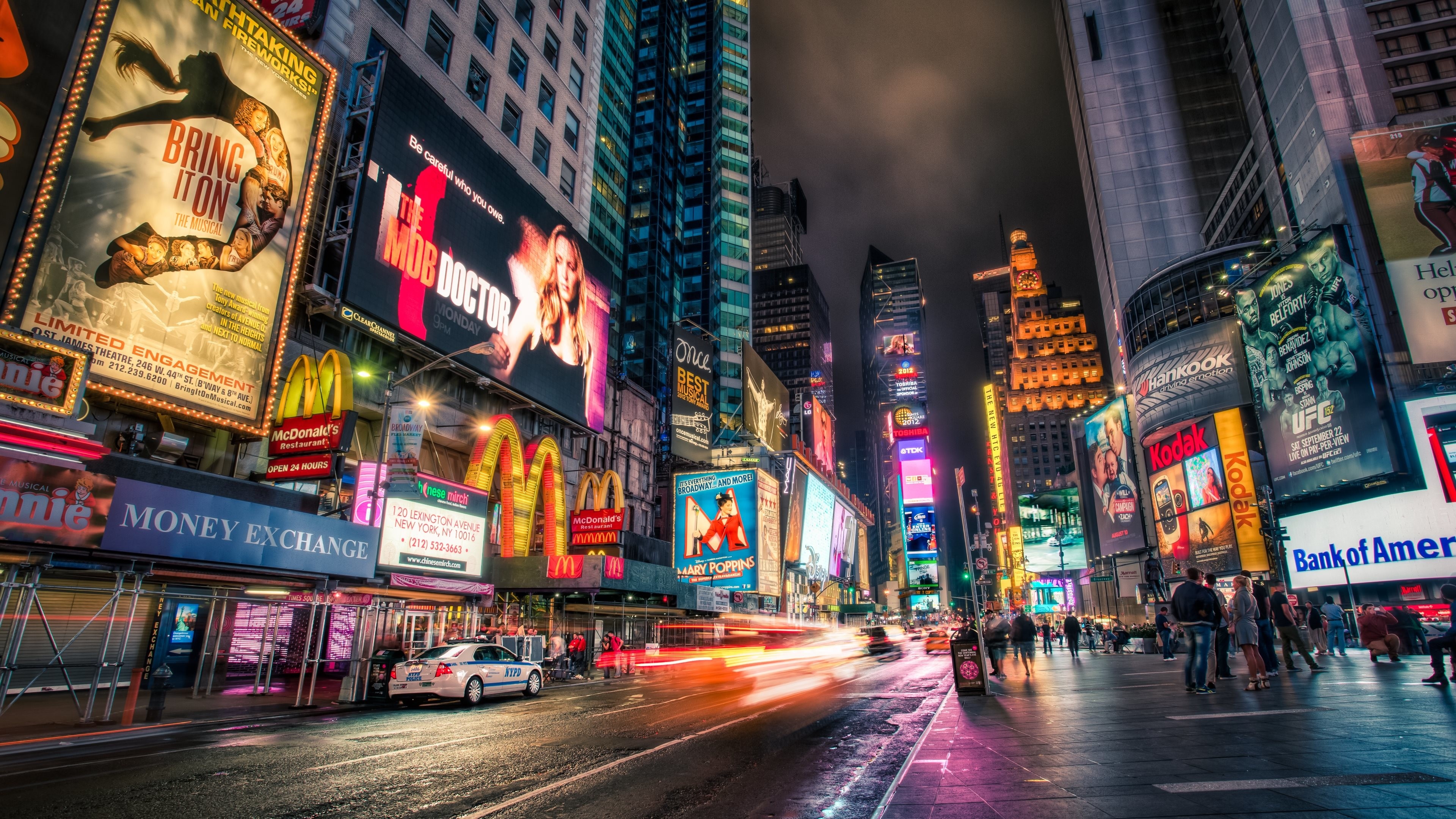 New York: Times Square, A major commercial intersection, tourist destination, entertainment hub, and neighborhood in Midtown Manhattan. 3840x2160 4K Wallpaper.