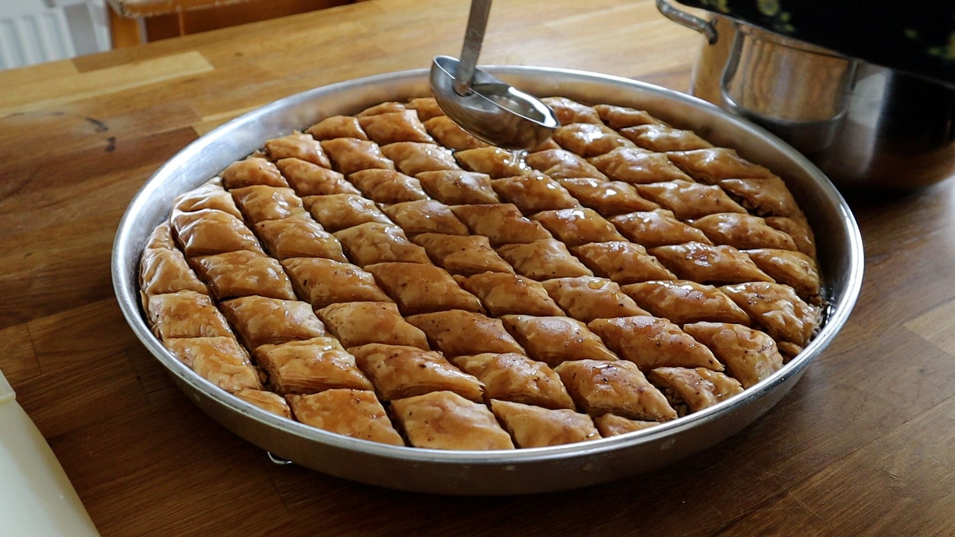 Baklava: Cooking involves layering dozens of sheets of phyllo pastry. 1920x1080 Full HD Background.