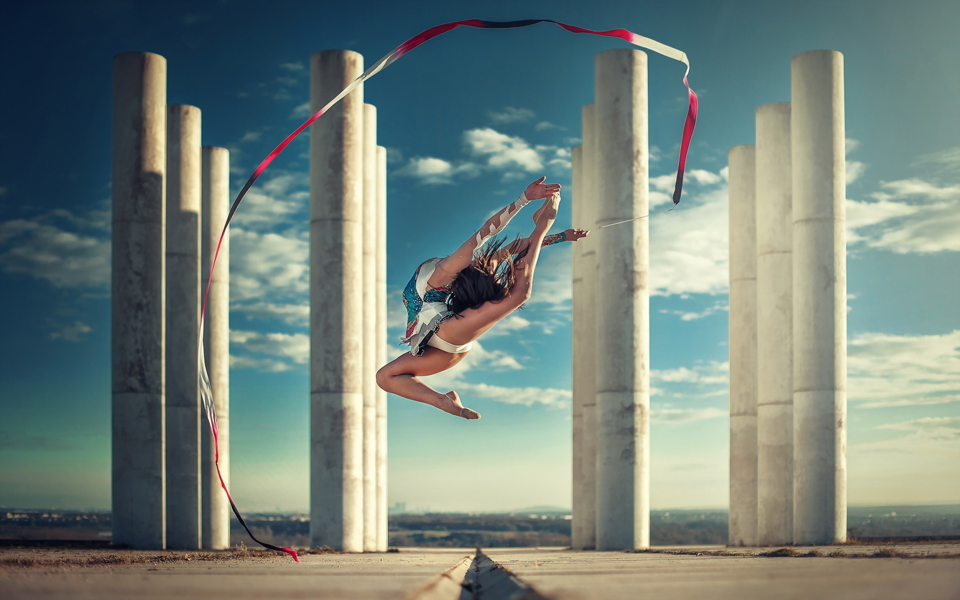 Rhythmic Gymnastics: Jumping tricks with a ribbon, Sports choreography in the street, Outdoor activity. 1920x1200 HD Background.