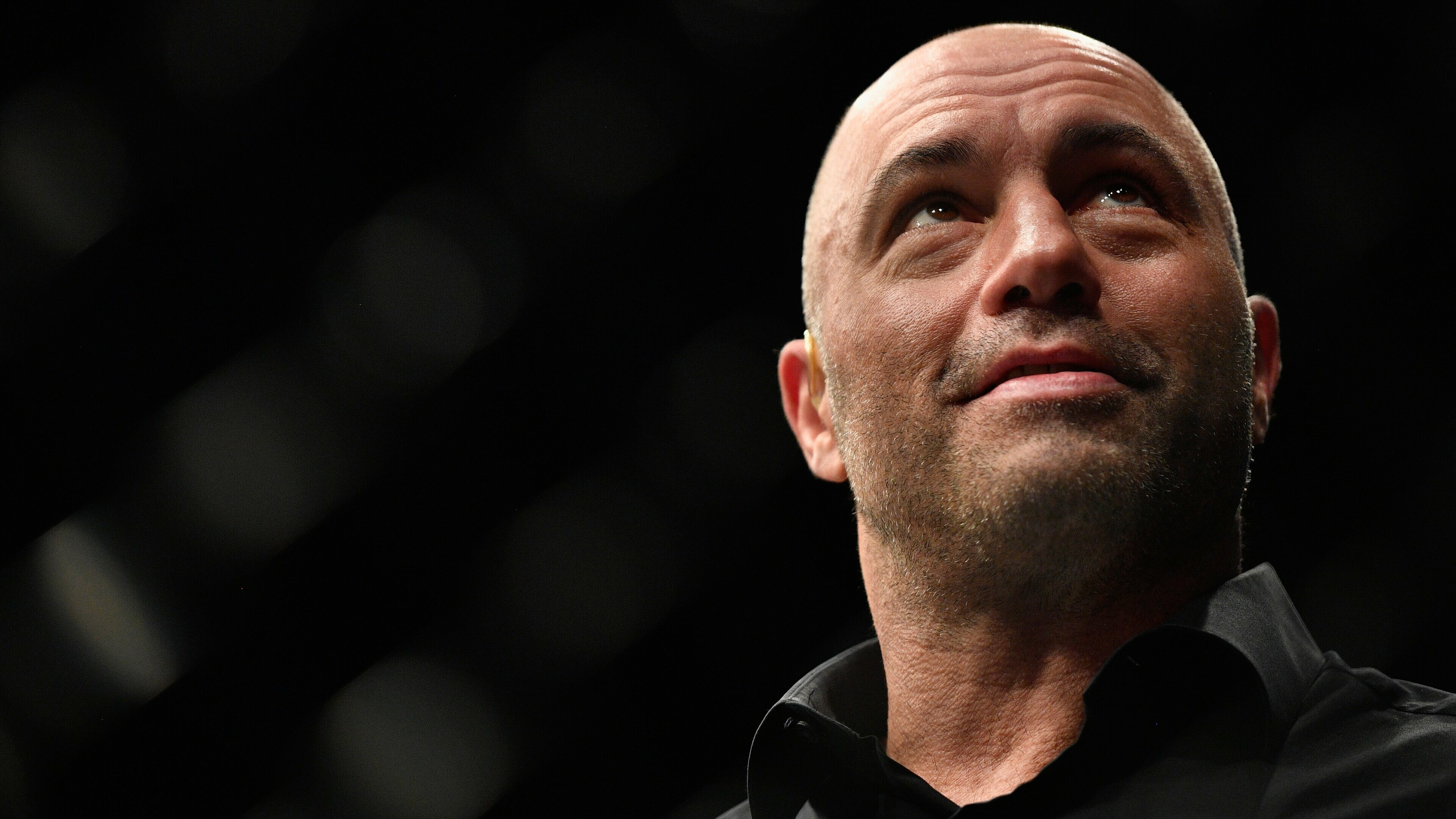 Joe Rogan: An American podcaster, comedian, actor, and former television presenter. 3840x2160 4K Background.
