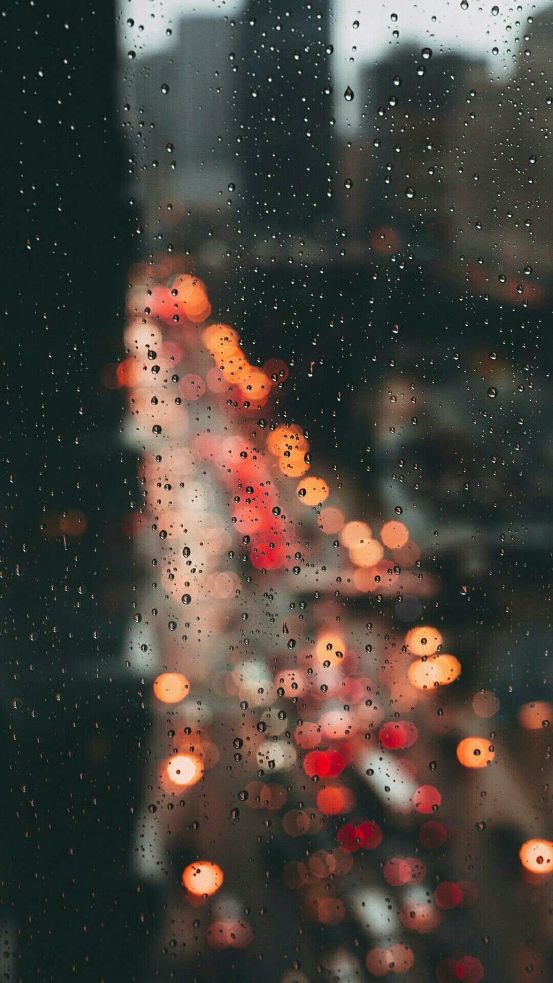 Rain: A large quantity of droplets falling rapidly from the sky. 1080x1920 Full HD Background.