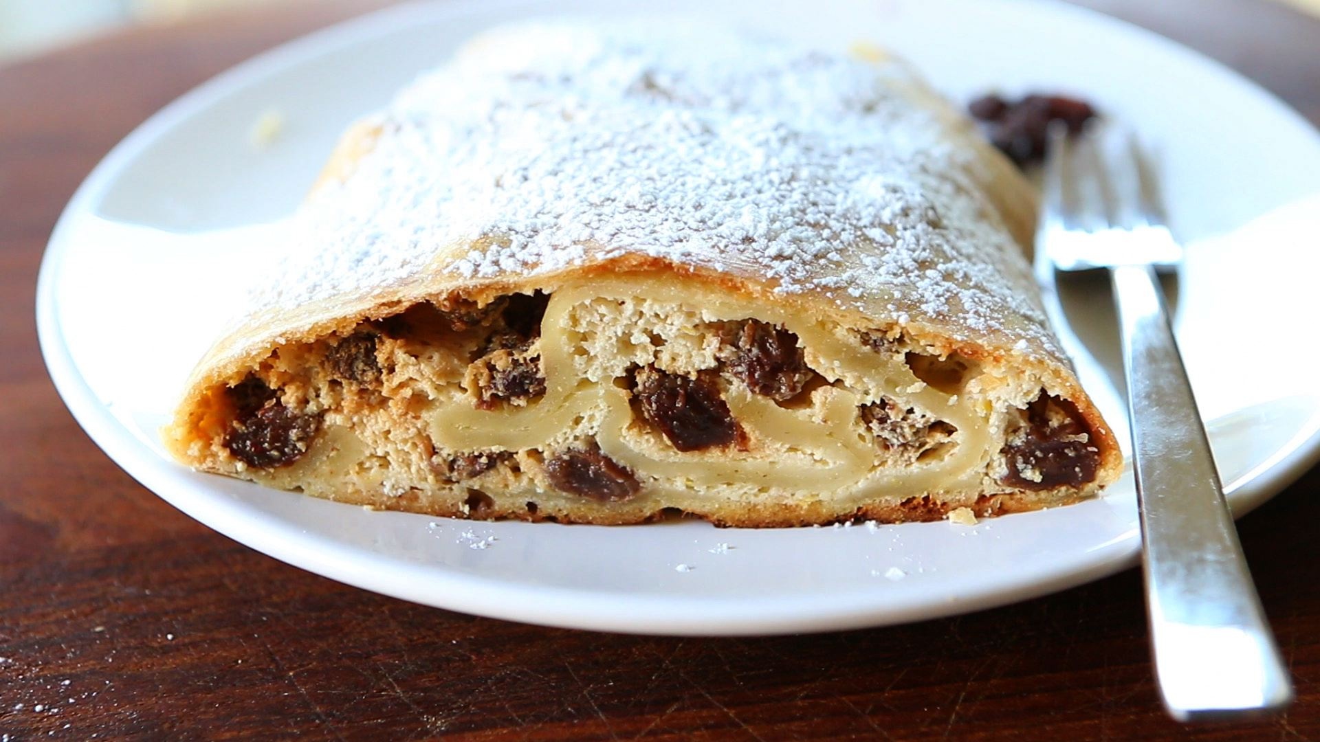 Strudel: Served in slices, The beautiful layers of dough and filling. 1920x1080 Full HD Background.
