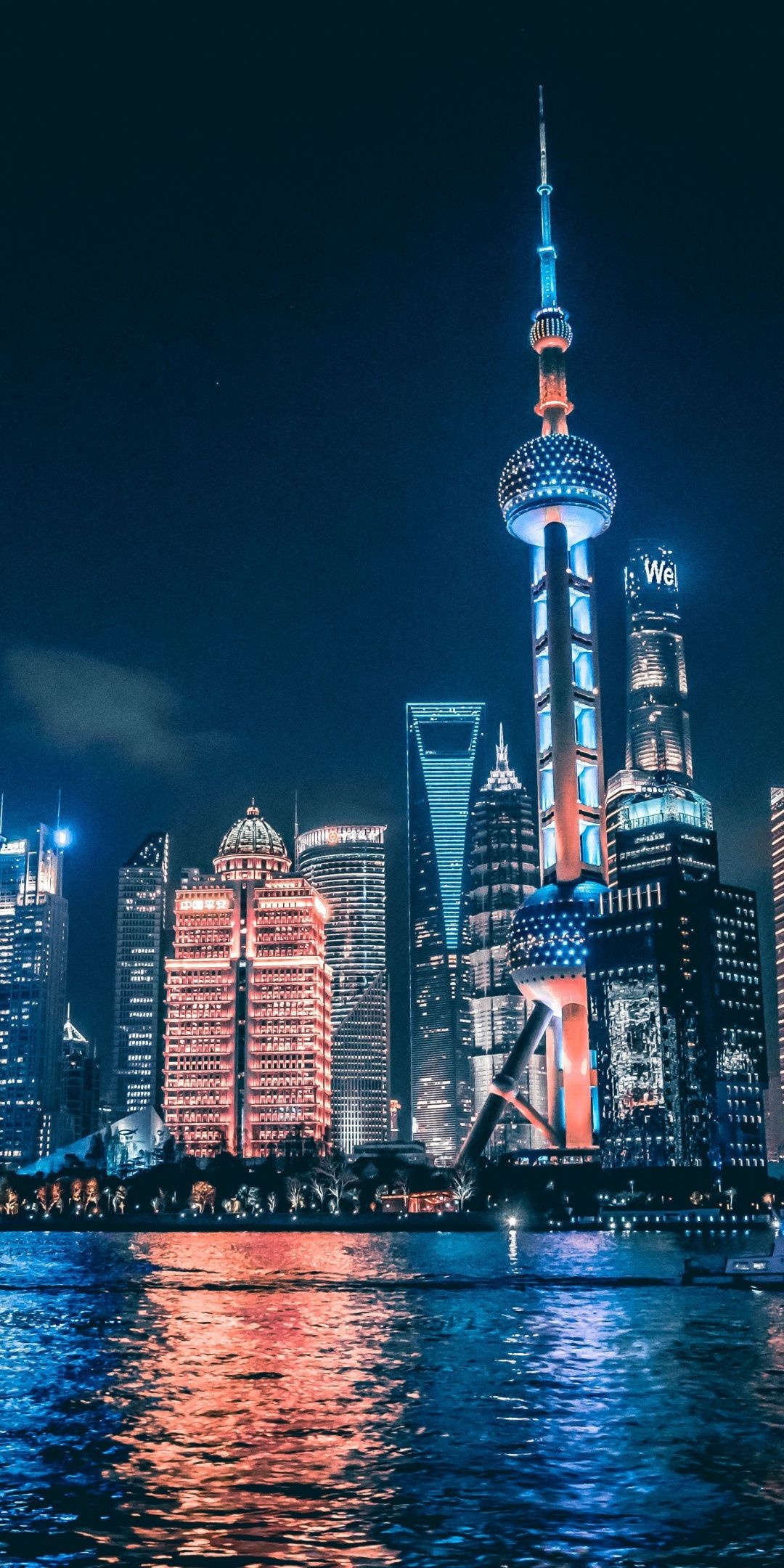 Cityscape: The view of the Oriental Pearl Tower at night, Shanghai, China. 1080x2160 HD Background.