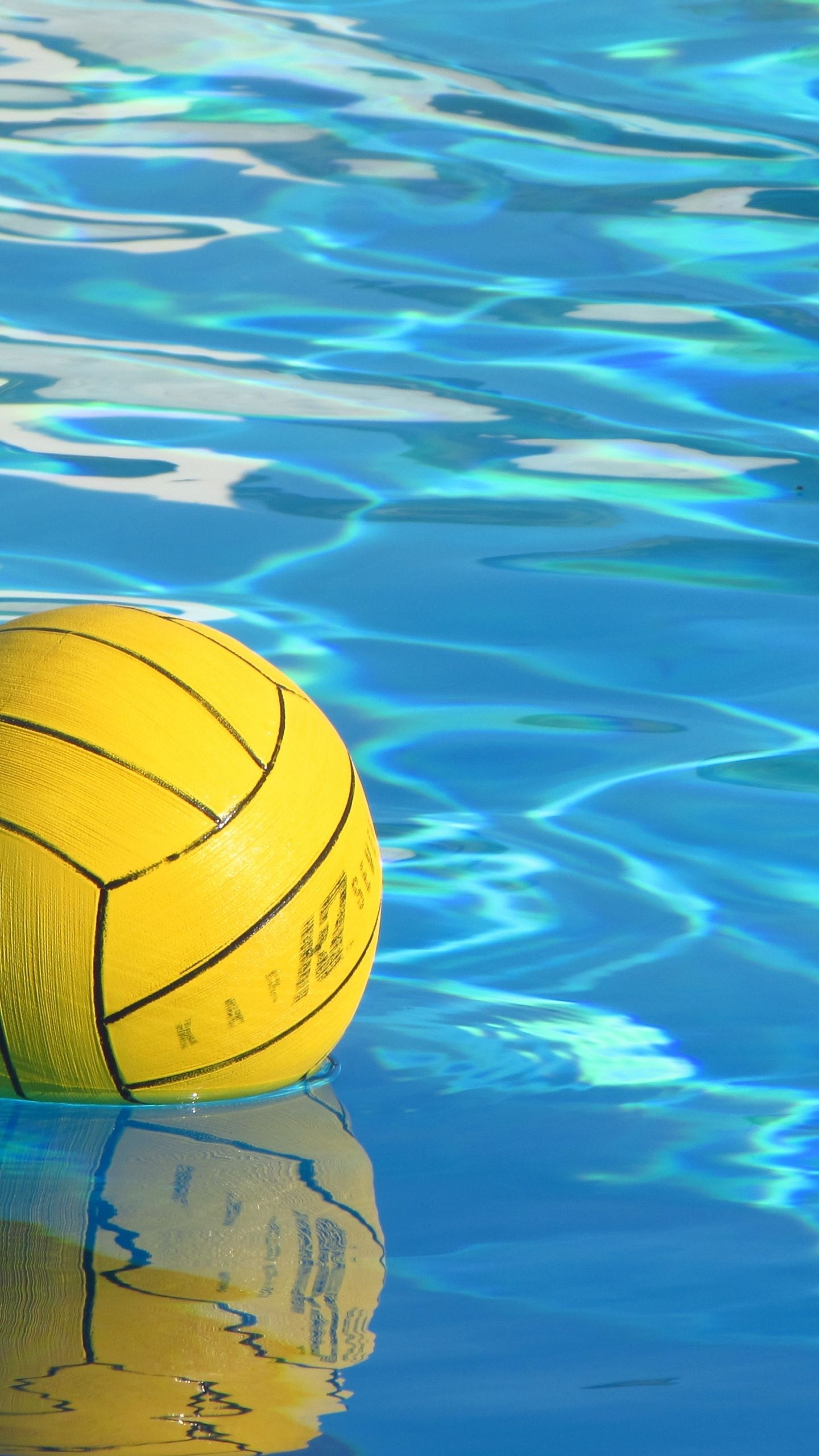 Water Polo: A bright yellow colored standard ball for competitive swim sports disciplines. 1440x2560 HD Wallpaper.